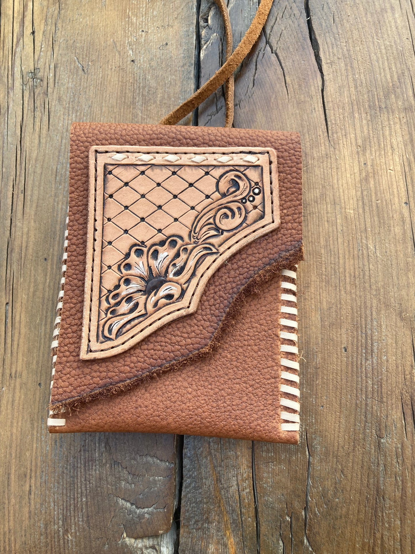 Saddle pouch cell phone holder