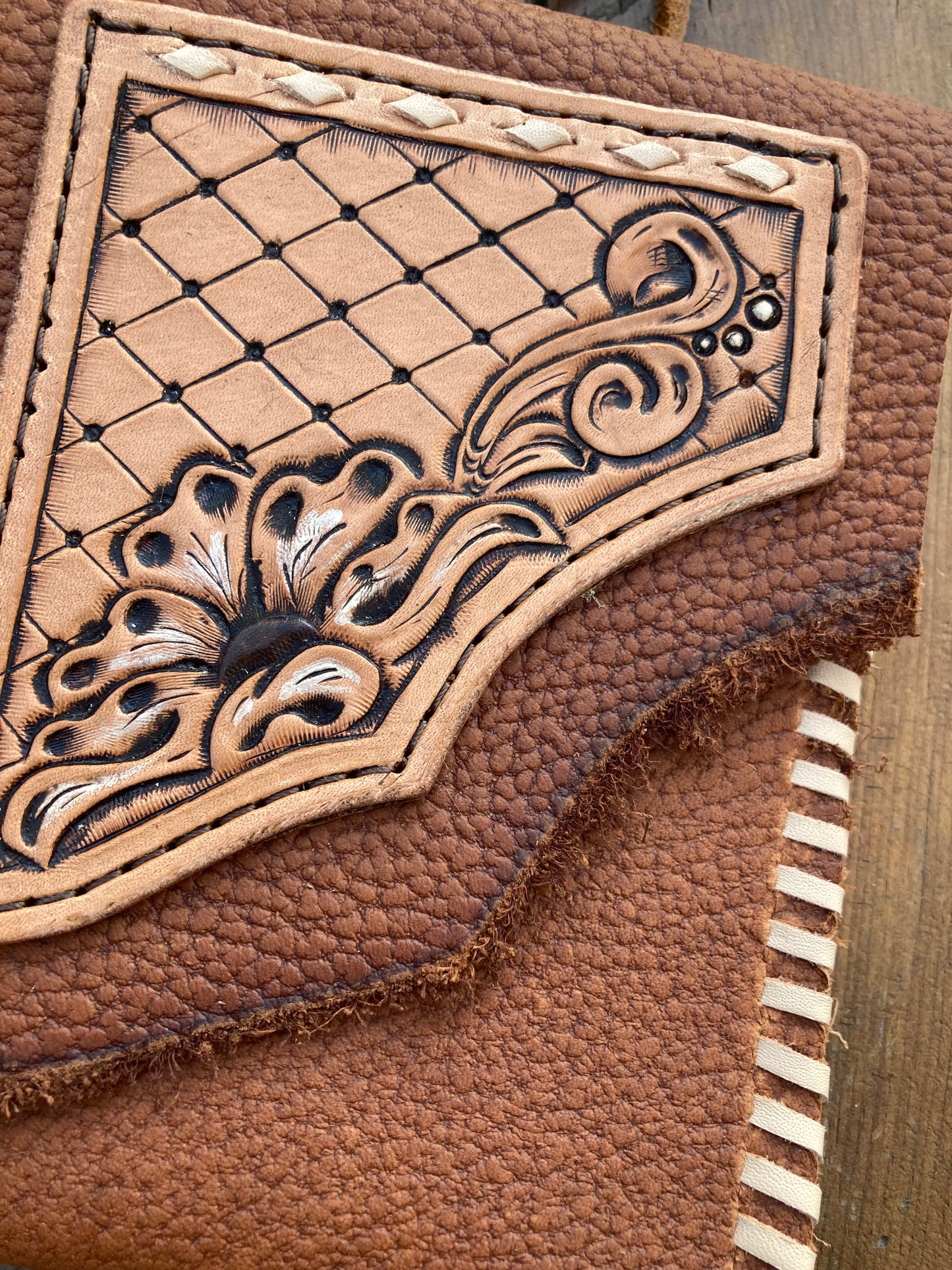 Saddle pouch cell phone holder