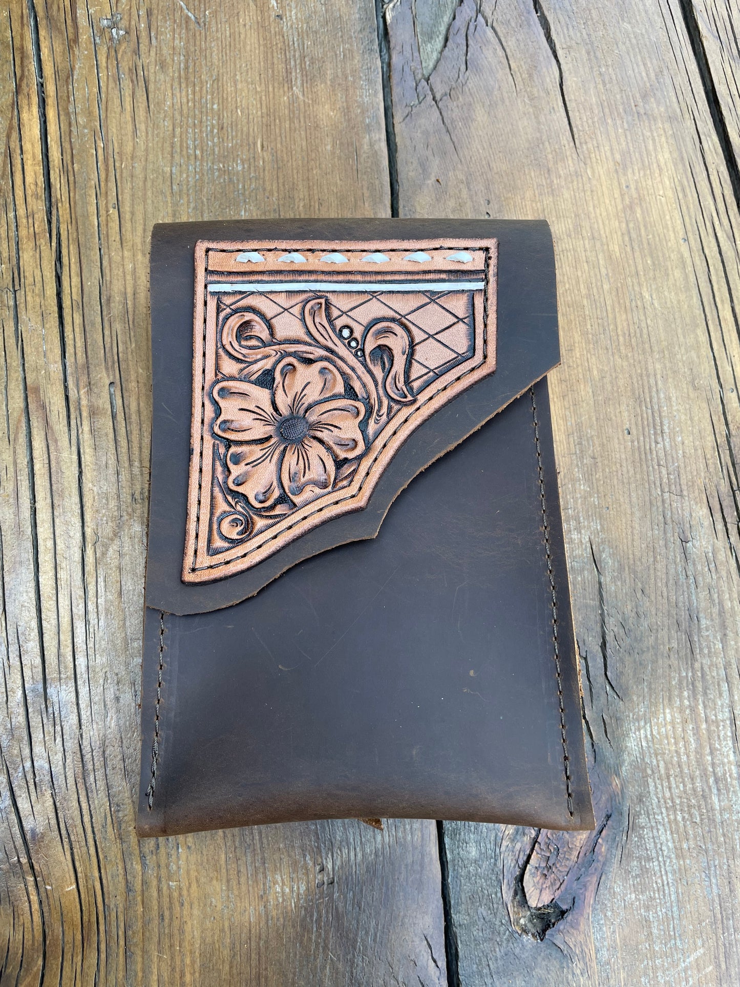 Saddle pouch cell phone holder