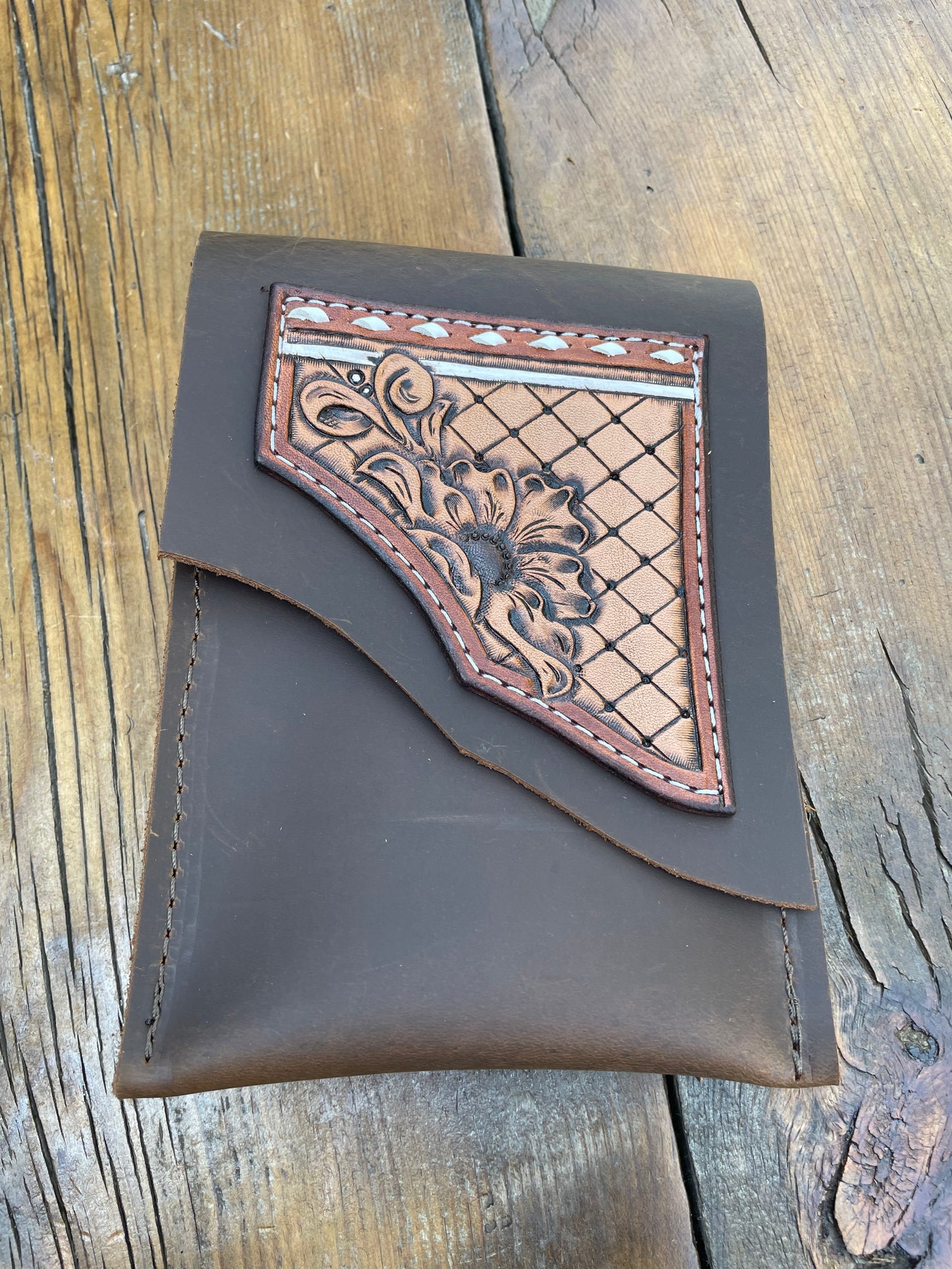 Saddle pouch cell phone holder