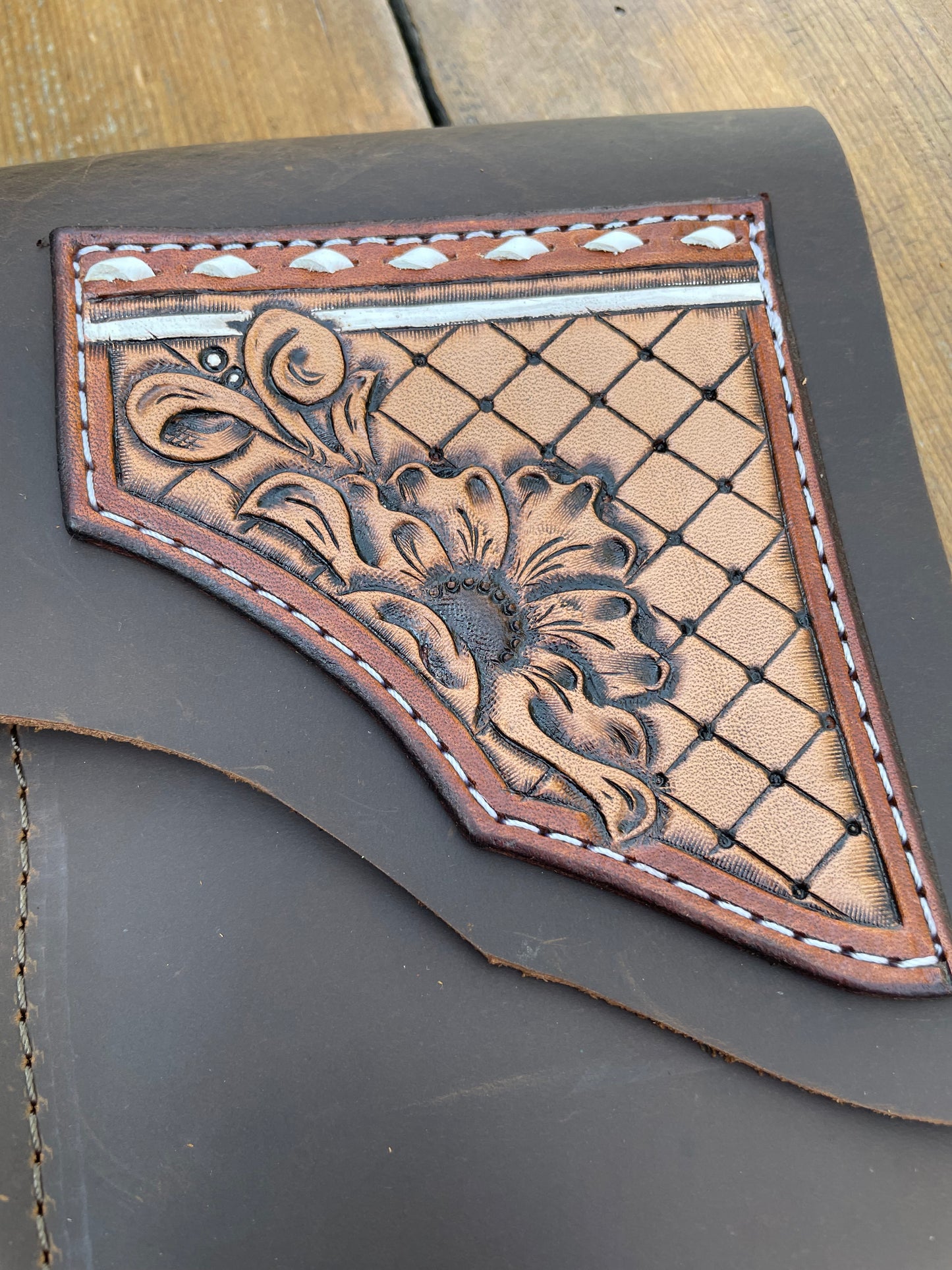 Saddle pouch cell phone holder