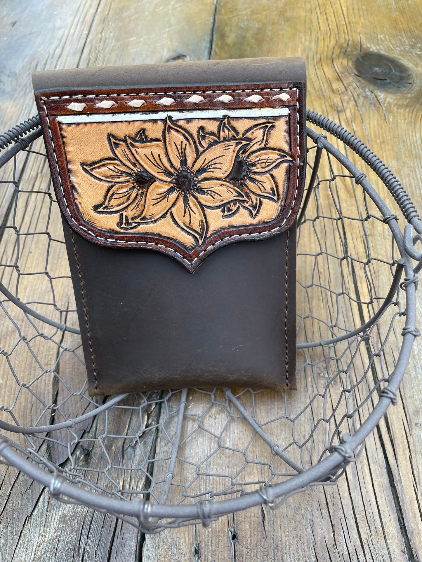 Saddle pouch cell phone holder