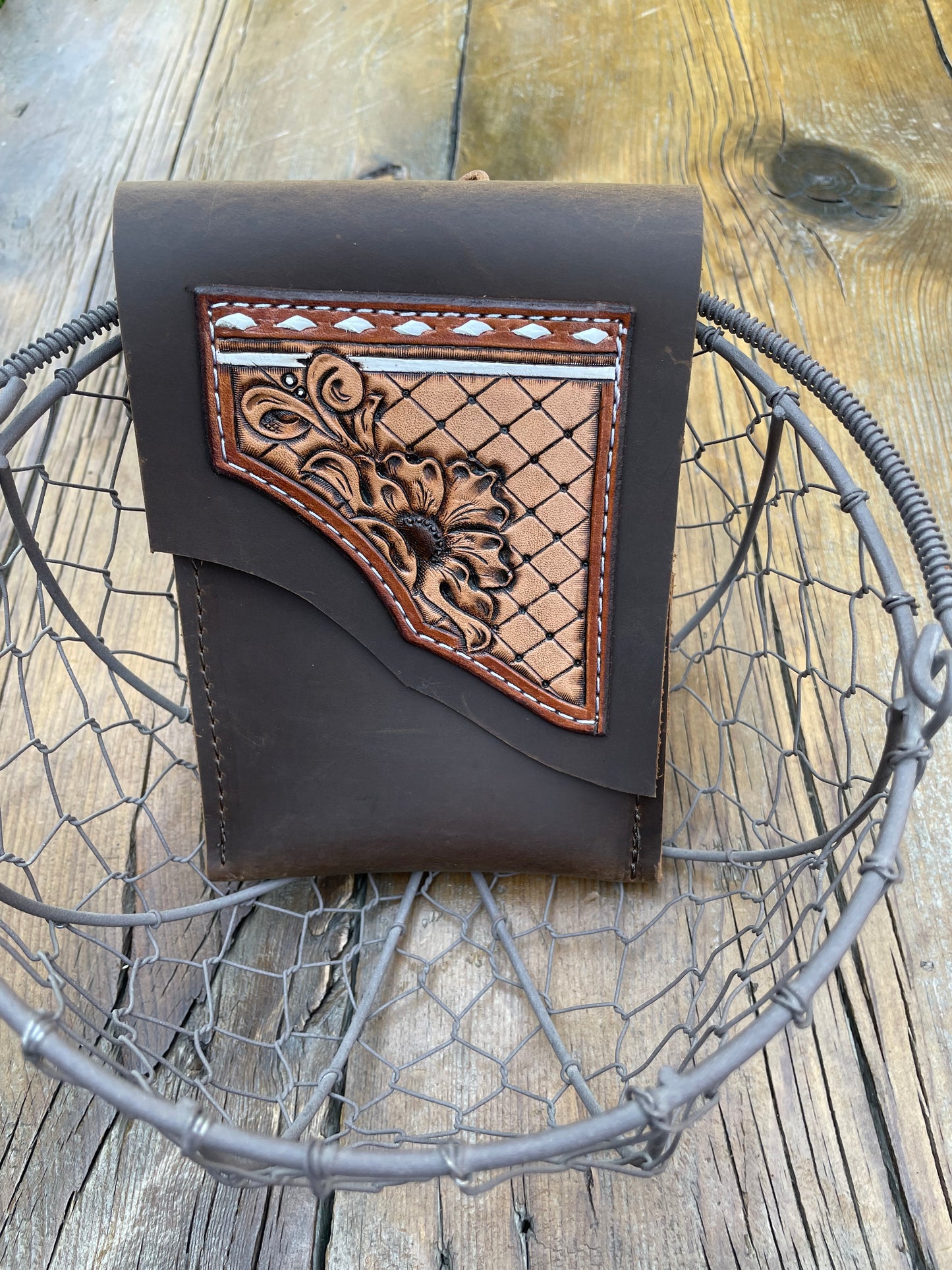 Saddle pouch cell phone holder