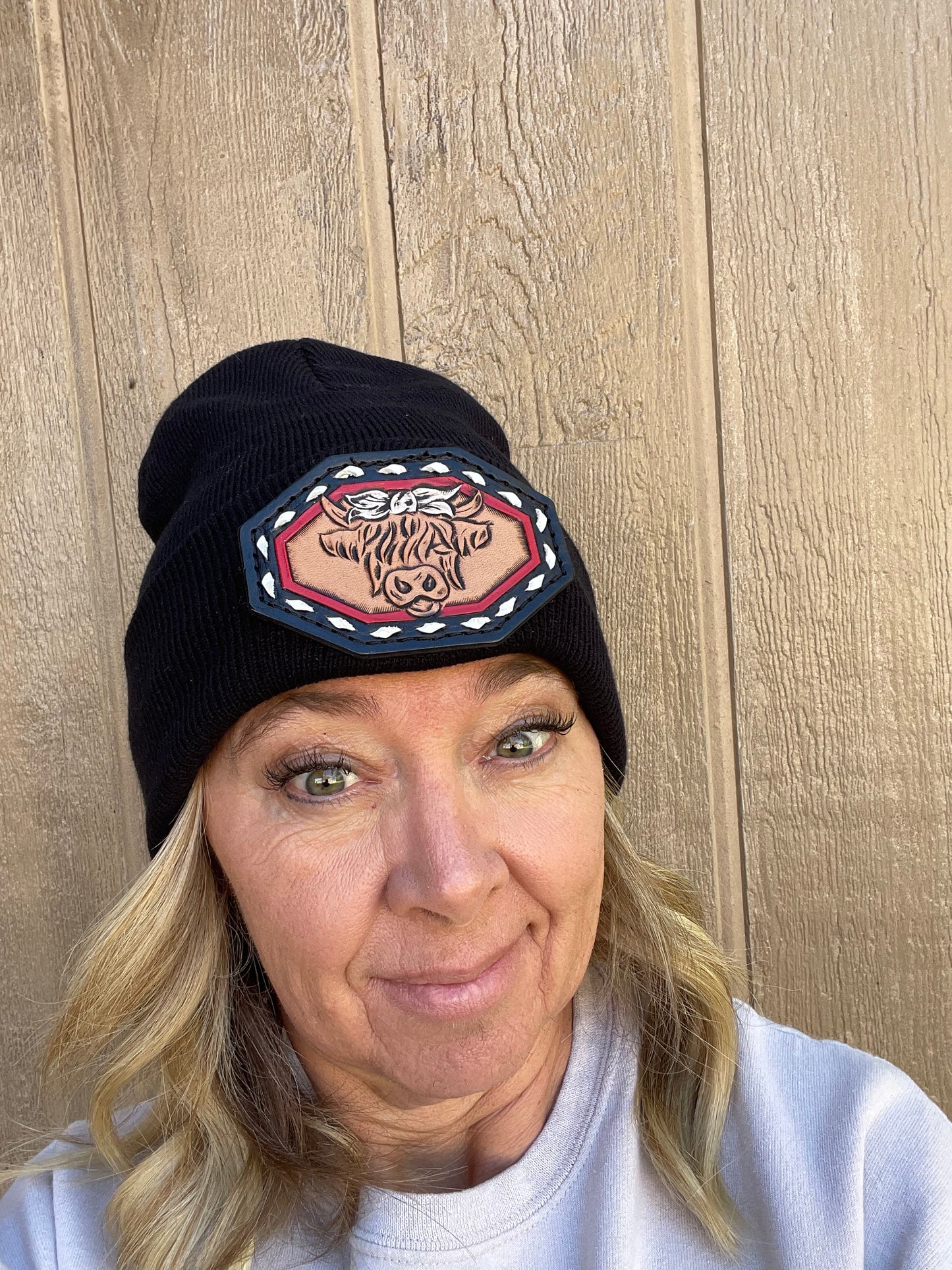 Black beanie with highlander cow and buck stitch