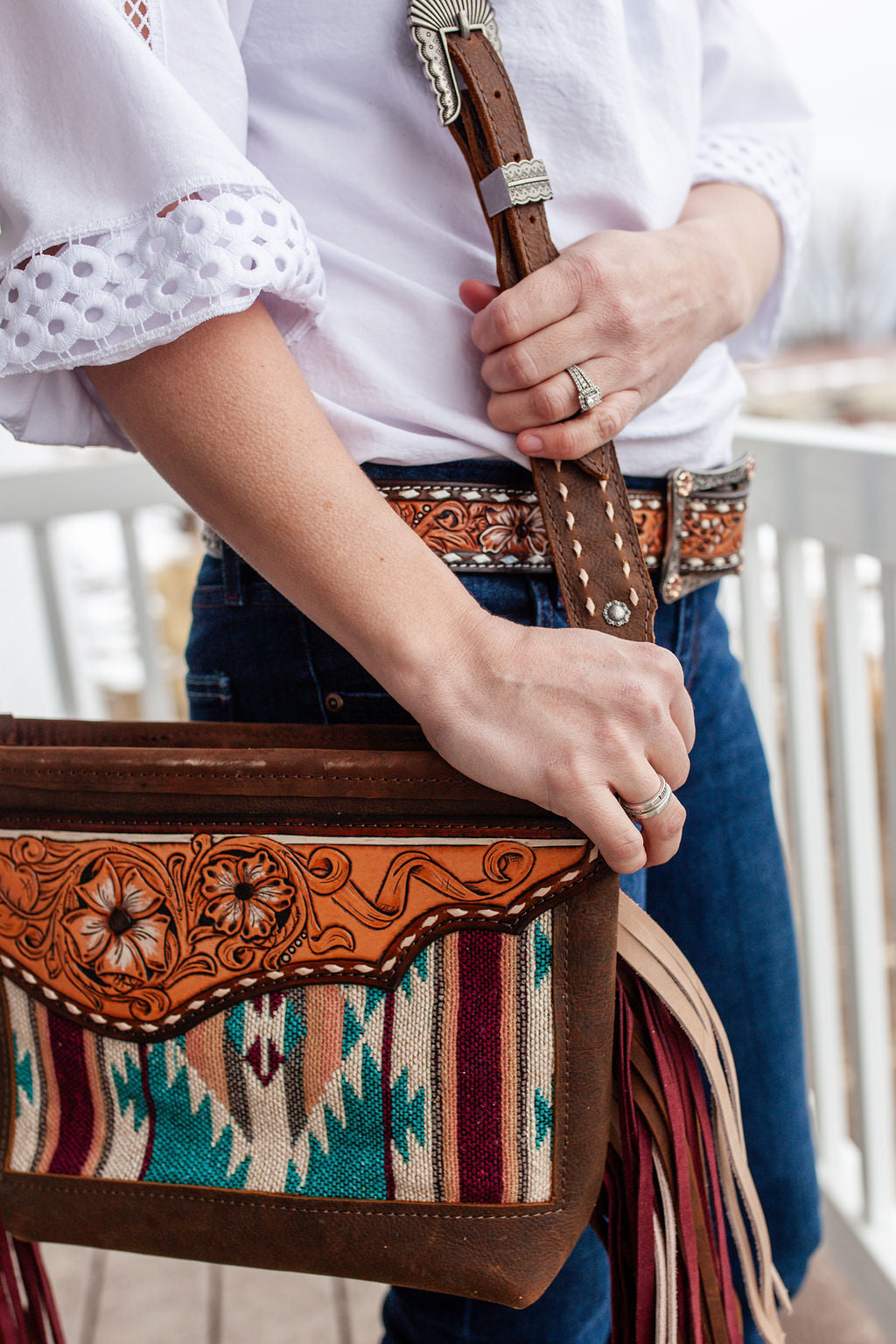 Purse with turquoise/maroon inlay, multicolored fringe & floral leather patch