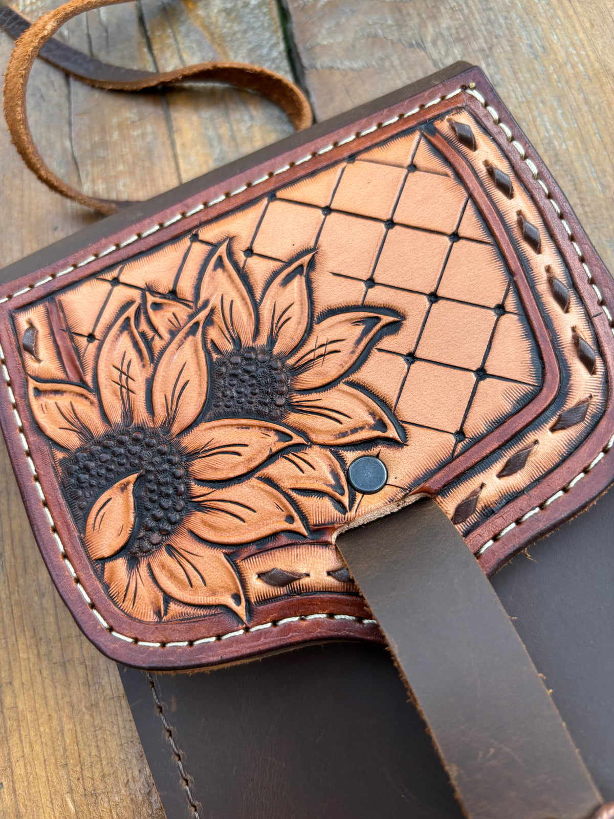Saddle pouch cell phone holder