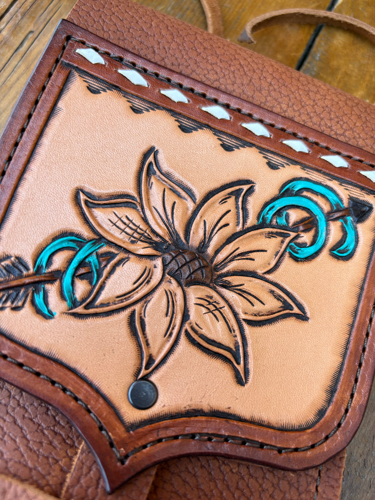 Saddle pouch cell phone holder