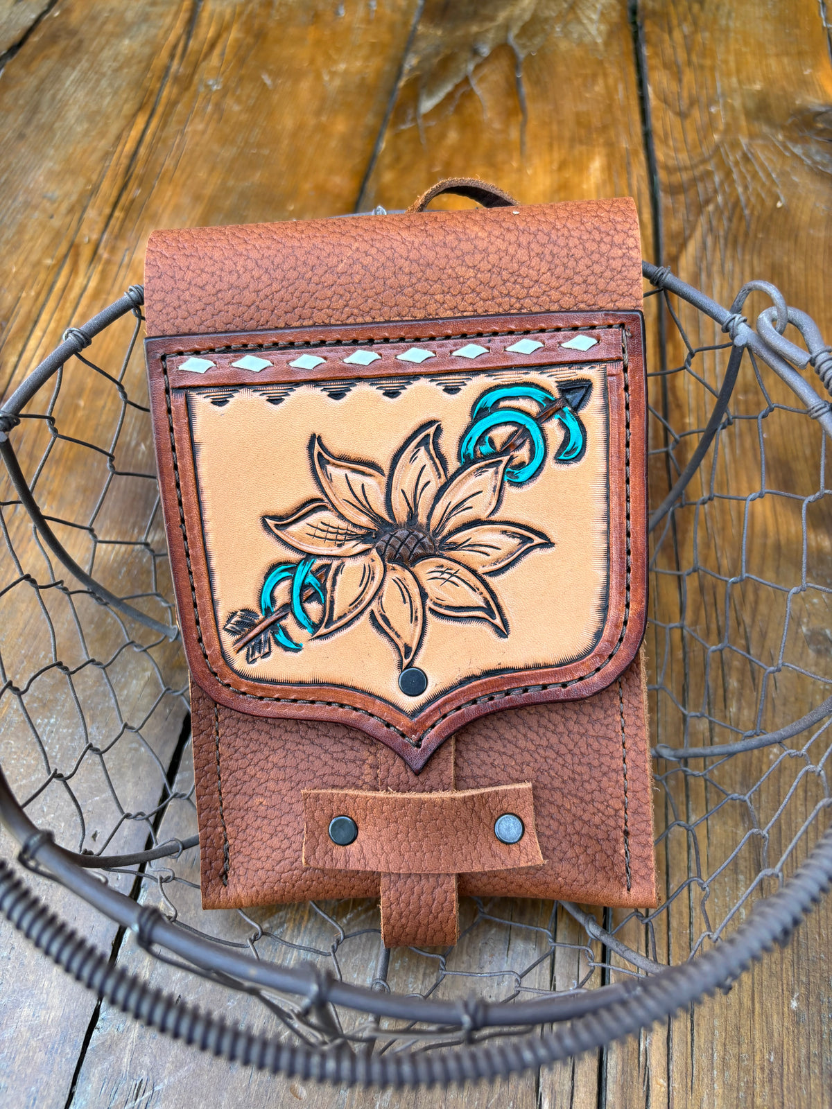 Saddle pouch cell phone holder