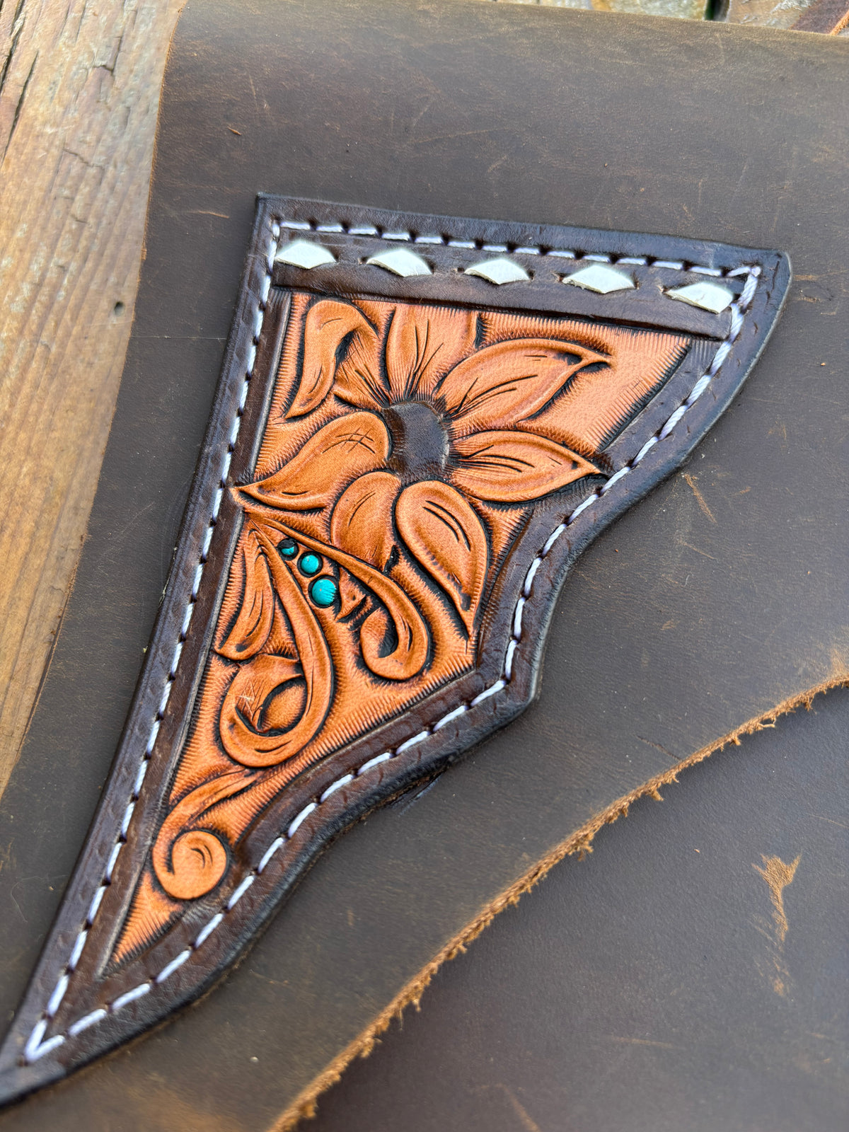 Saddle pouch cell phone holder