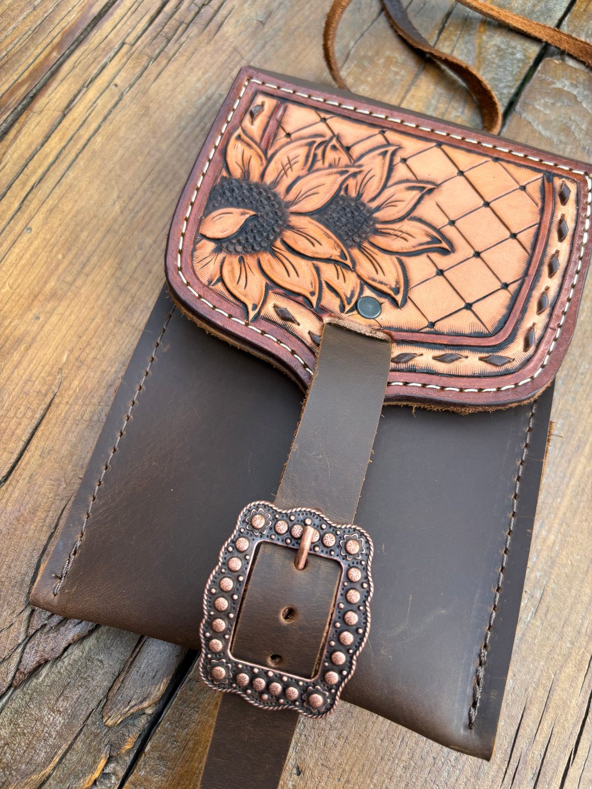Saddle pouch cell phone holder
