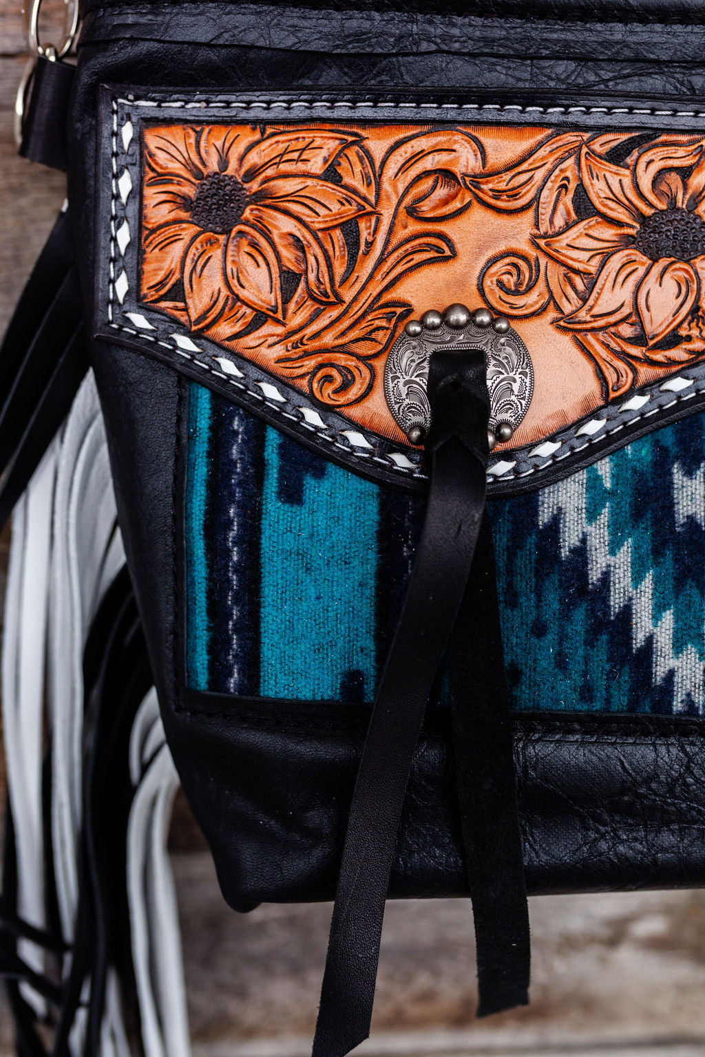 Purse with turquoise/black inlay, black & white fringe & floral leather patch