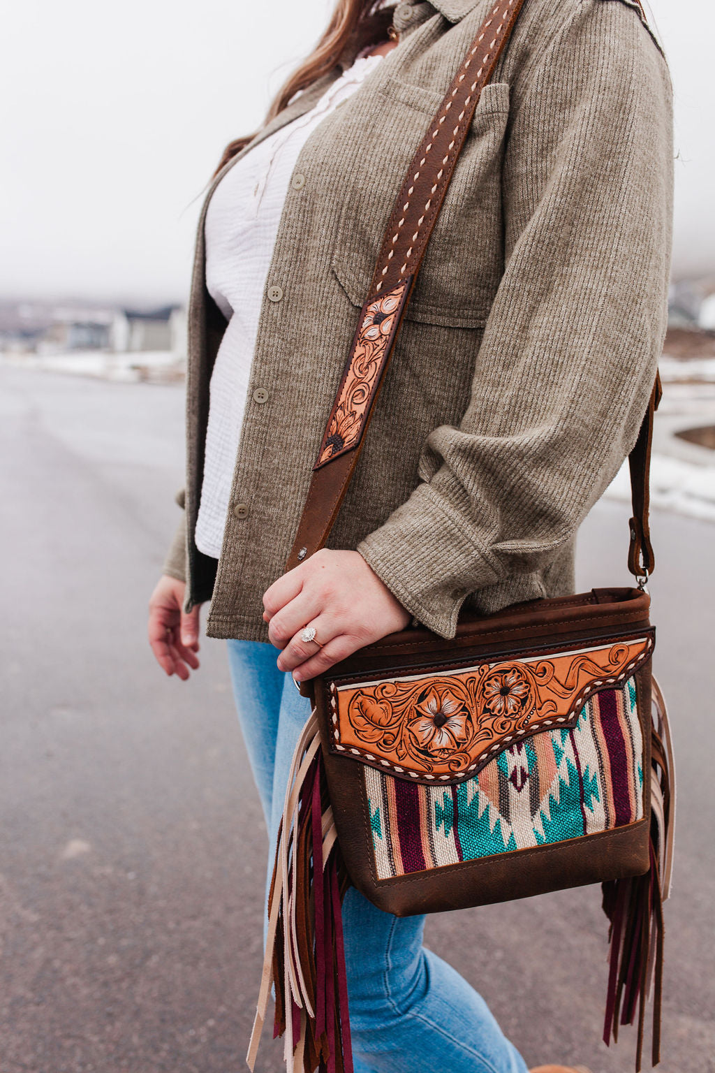 Purse with turquoise/maroon inlay, multicolored fringe & floral leather patch