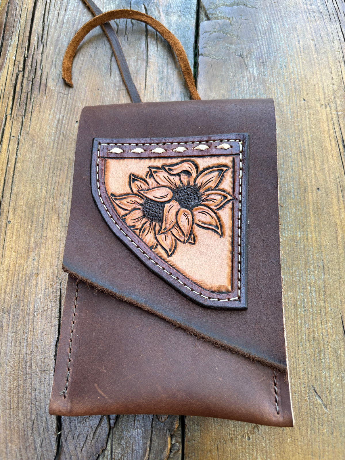 Saddle pouch cell phone holder