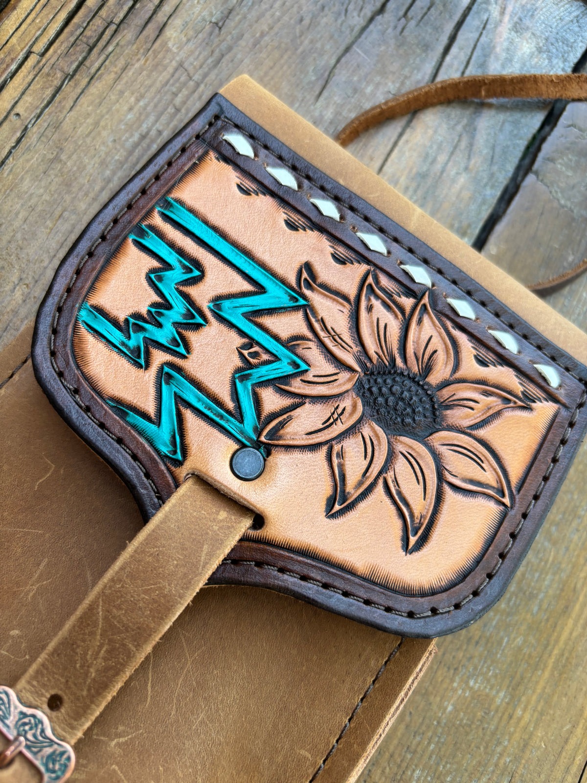 Saddle pouch cell phone holder