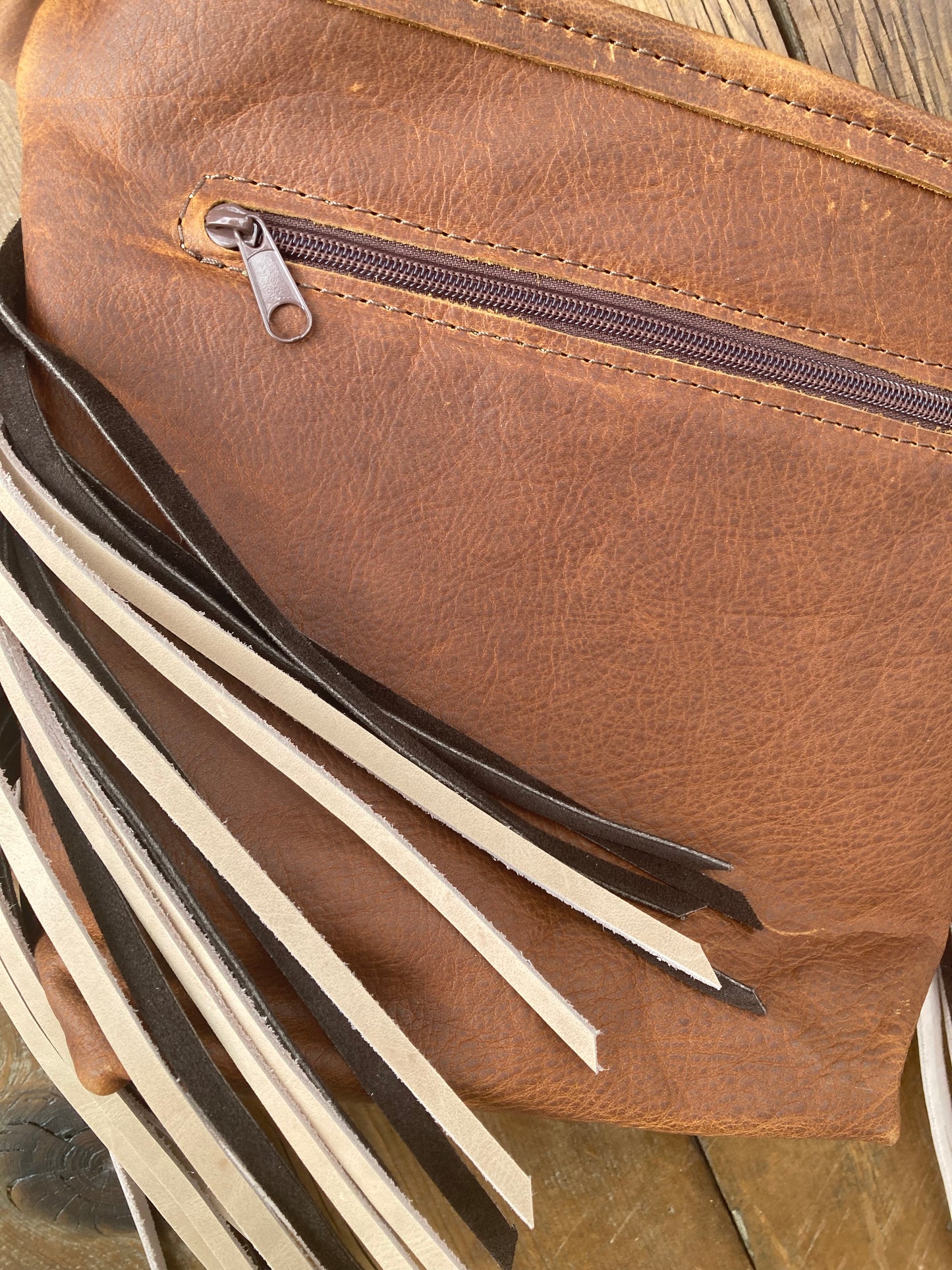 Purse brown with cream & brown fringe and floral tooled patch