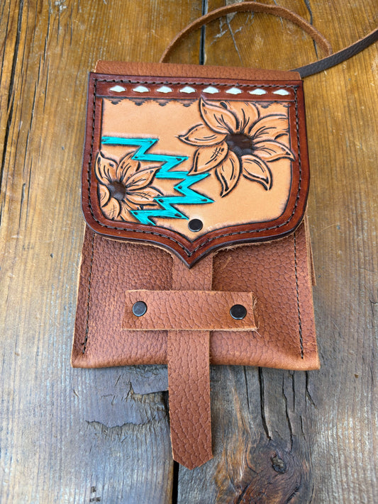 Saddle pouch cell phone holder