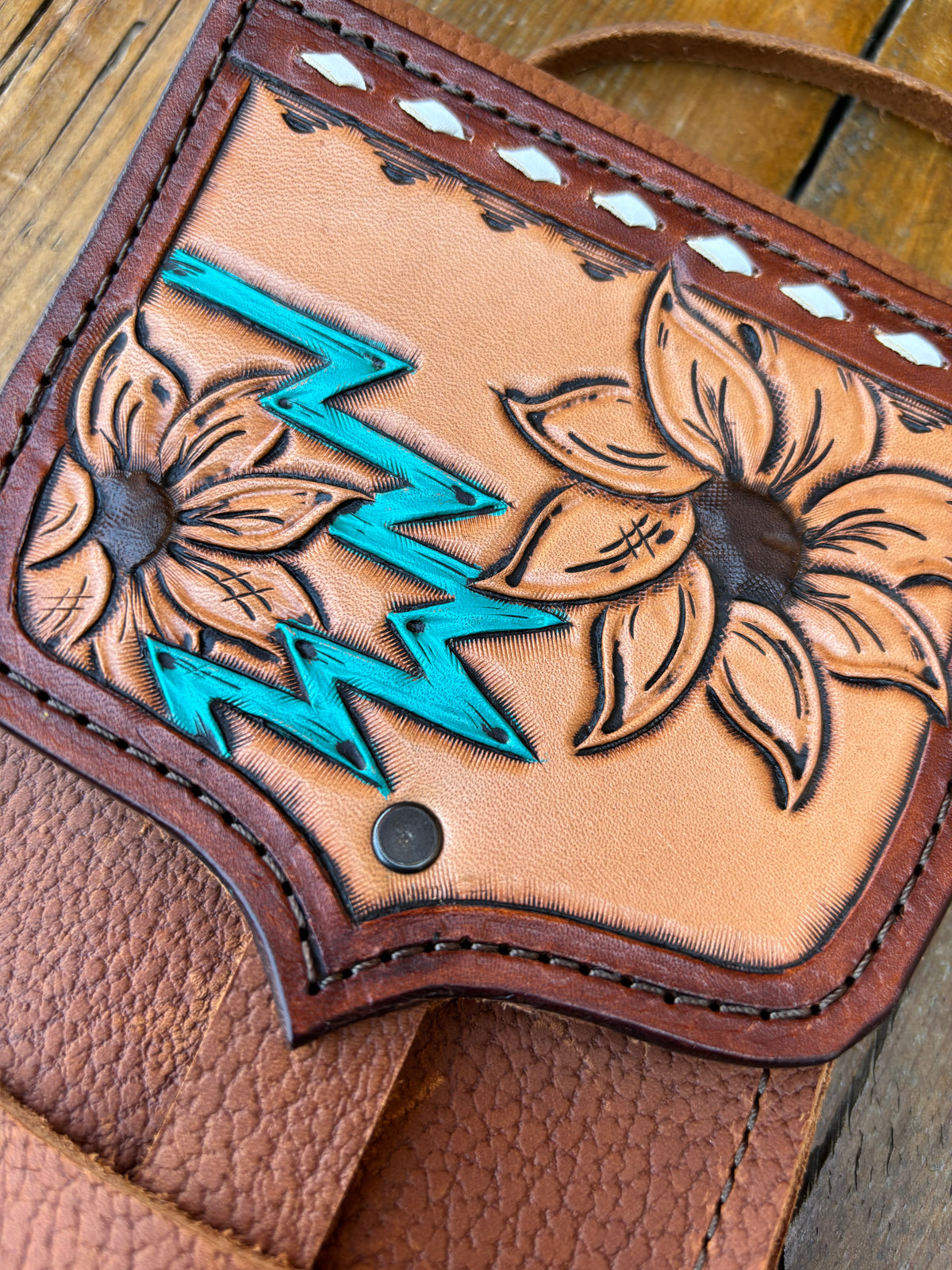 Saddle pouch cell phone holder