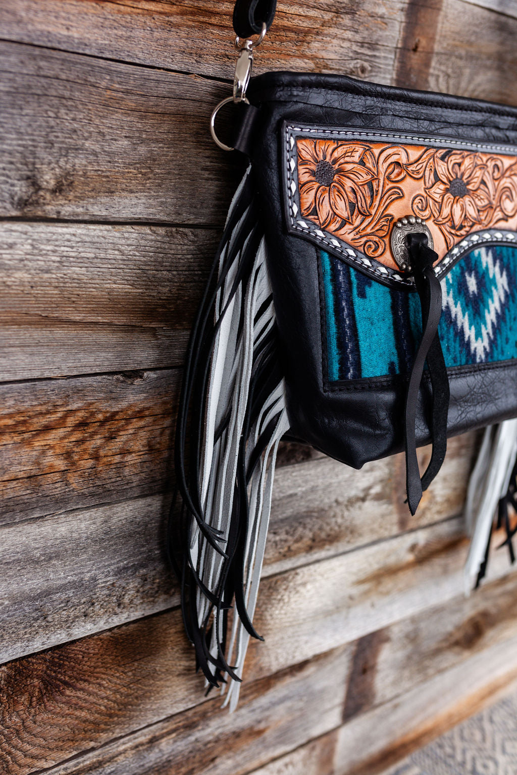 Purse with turquoise/black inlay, black & white fringe & floral leather patch