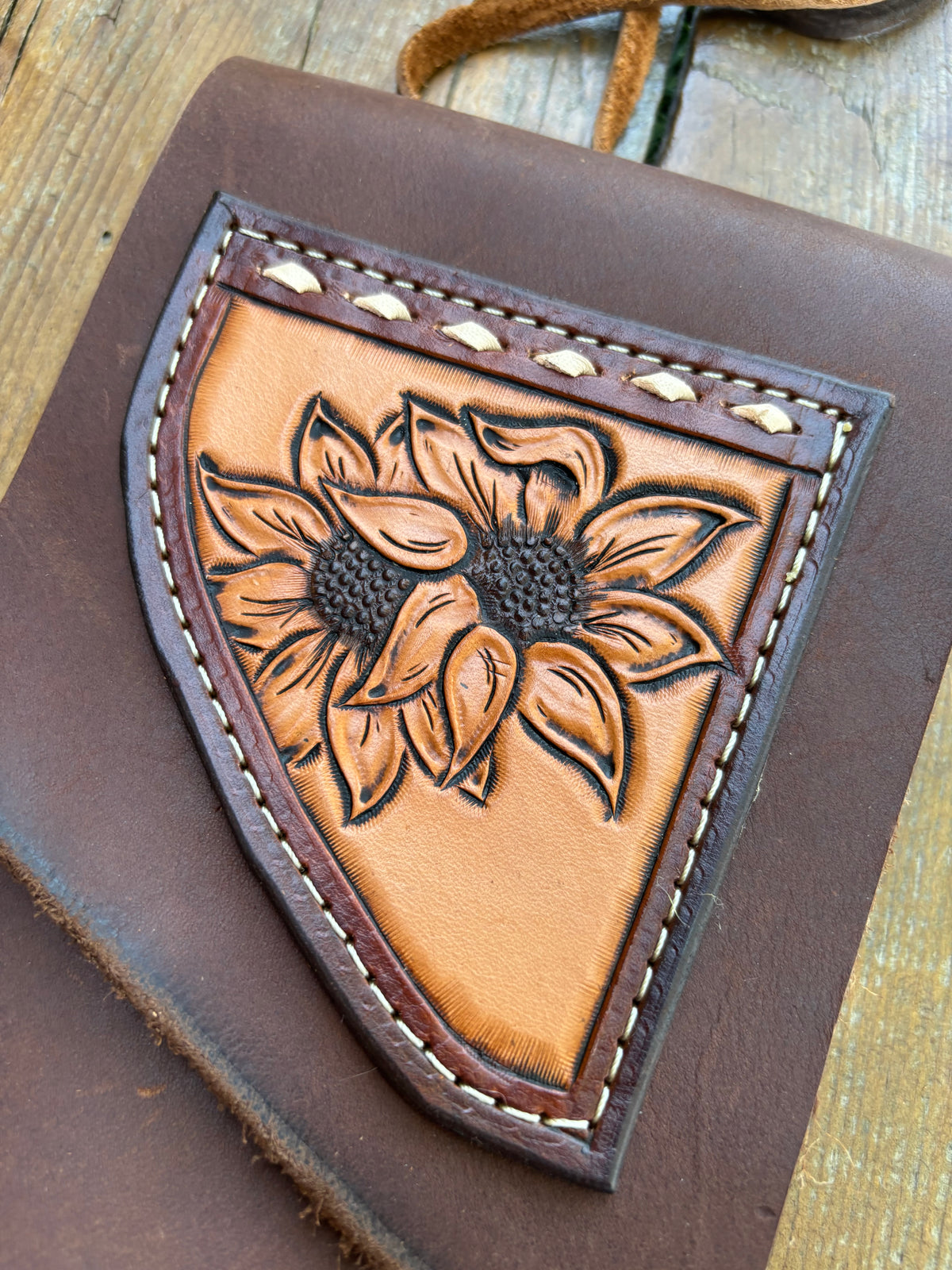 Saddle pouch cell phone holder