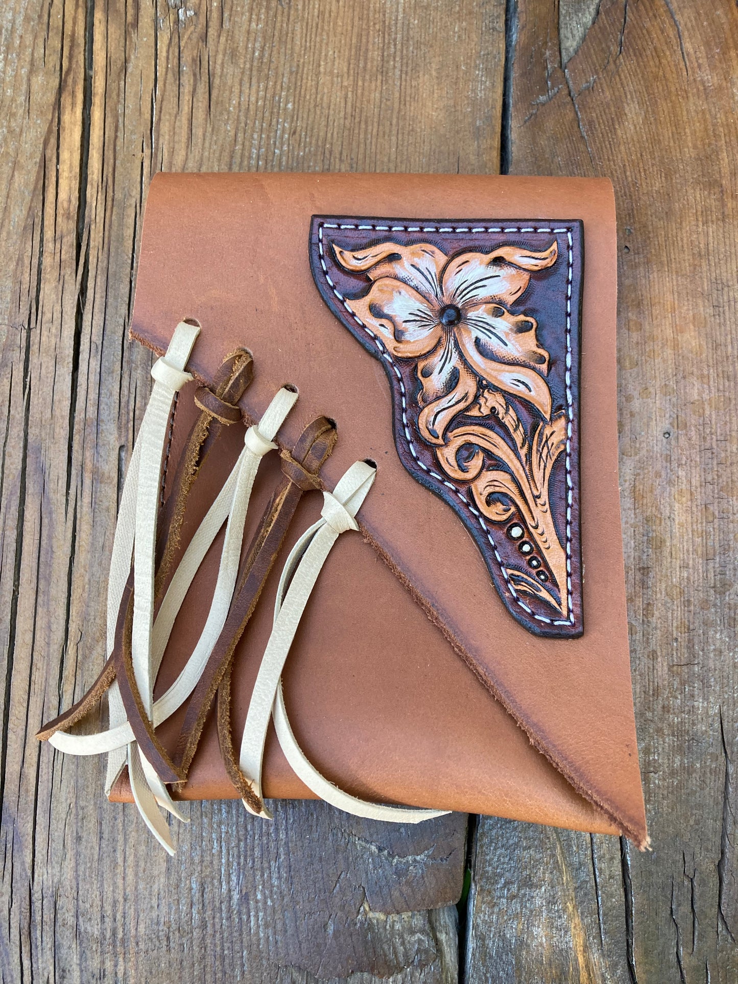 Saddle pouch cell phone holder