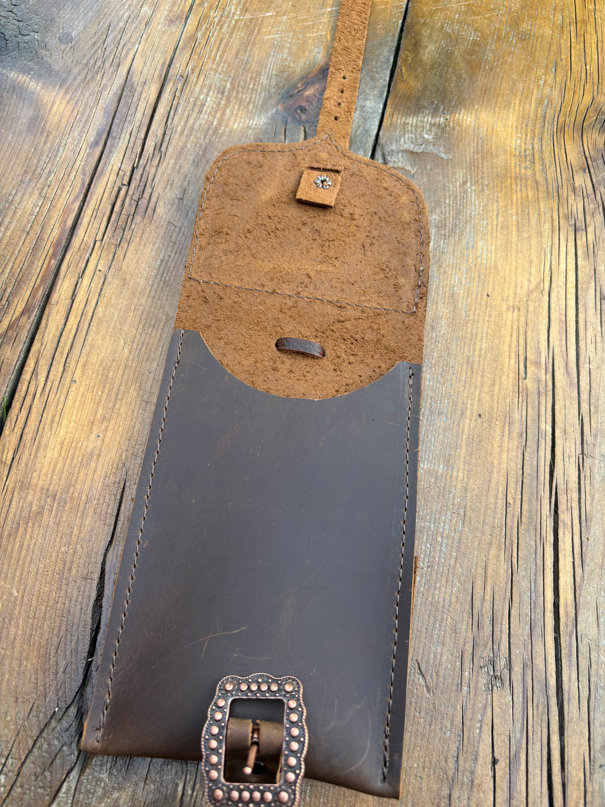 Saddle pouch cell phone holder