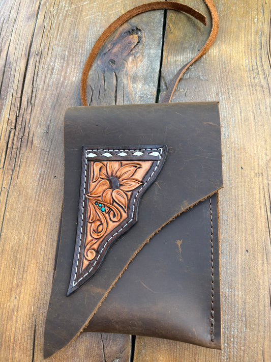 Saddle pouch cell phone holder