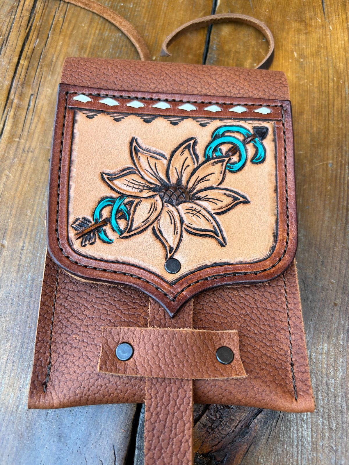 Saddle pouch cell phone holder