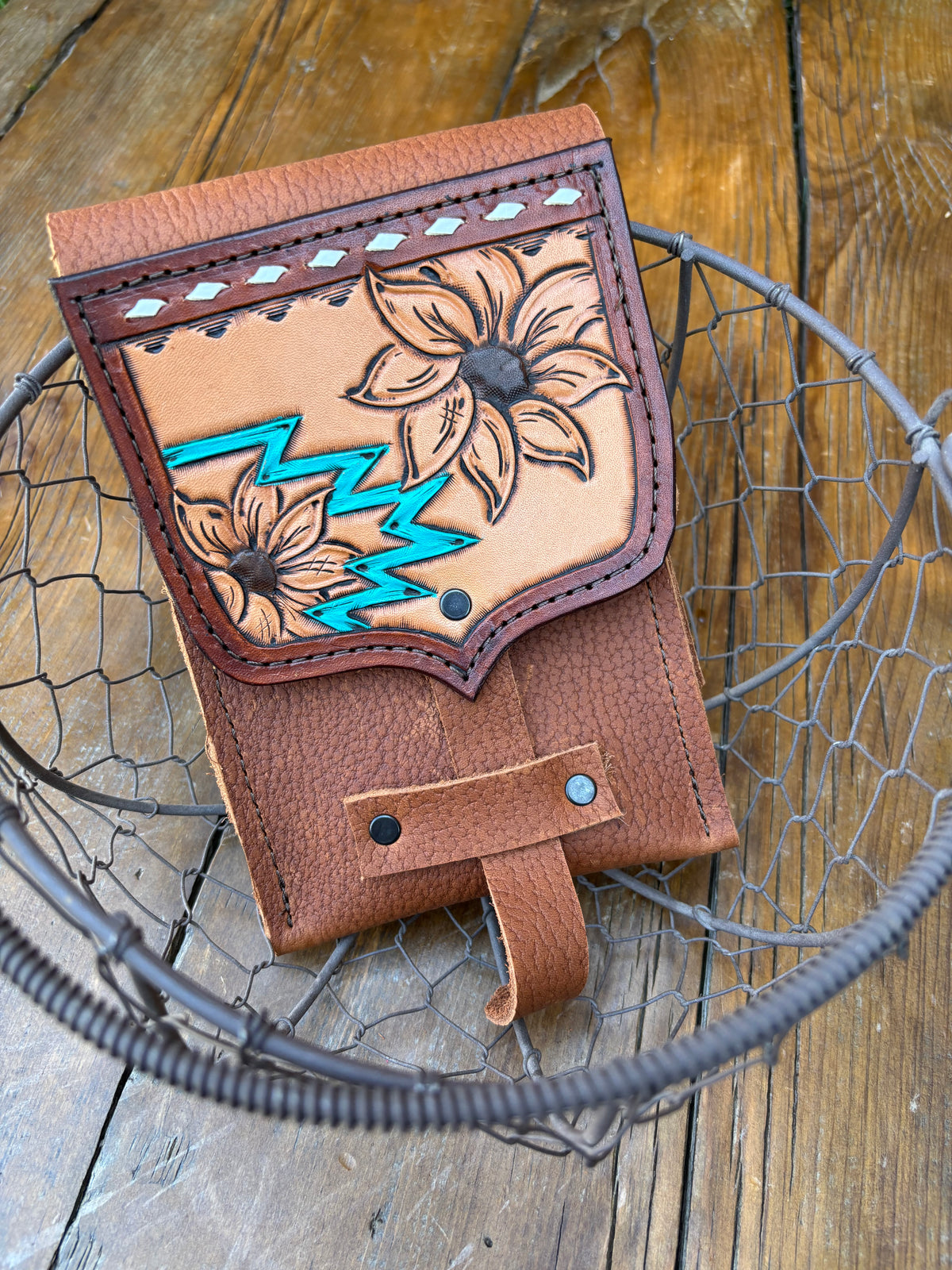 Saddle pouch cell phone holder