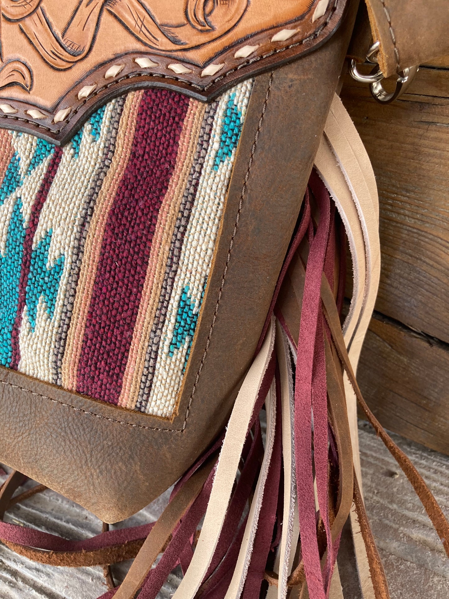 Purse with turquoise/maroon inlay, multicolored fringe & floral leather patch