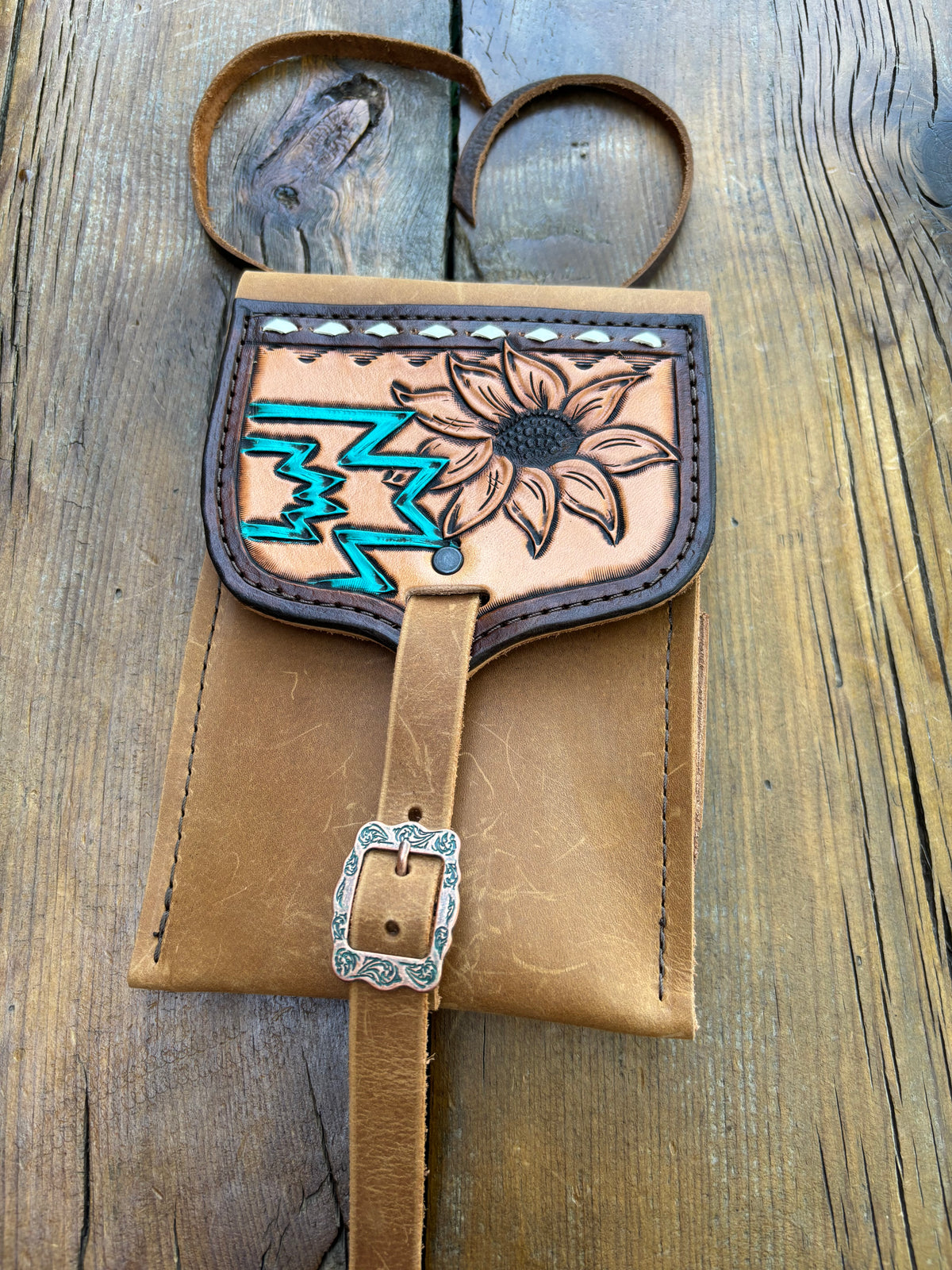 Saddle pouch cell phone holder