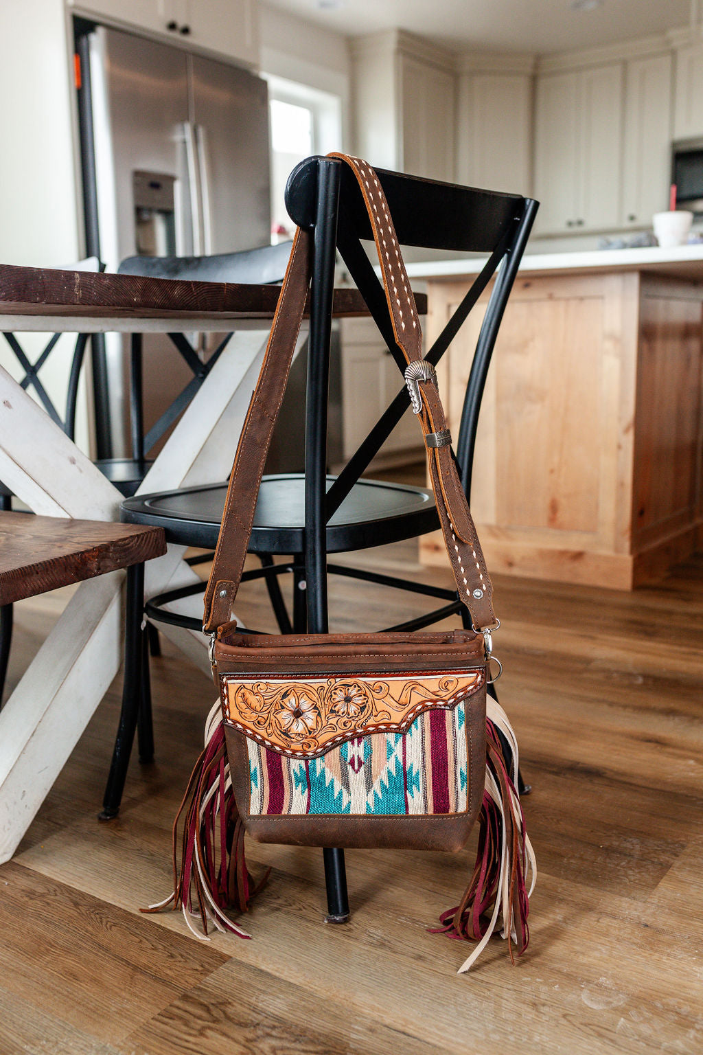 Purse with turquoise/maroon inlay, multicolored fringe & floral leather patch