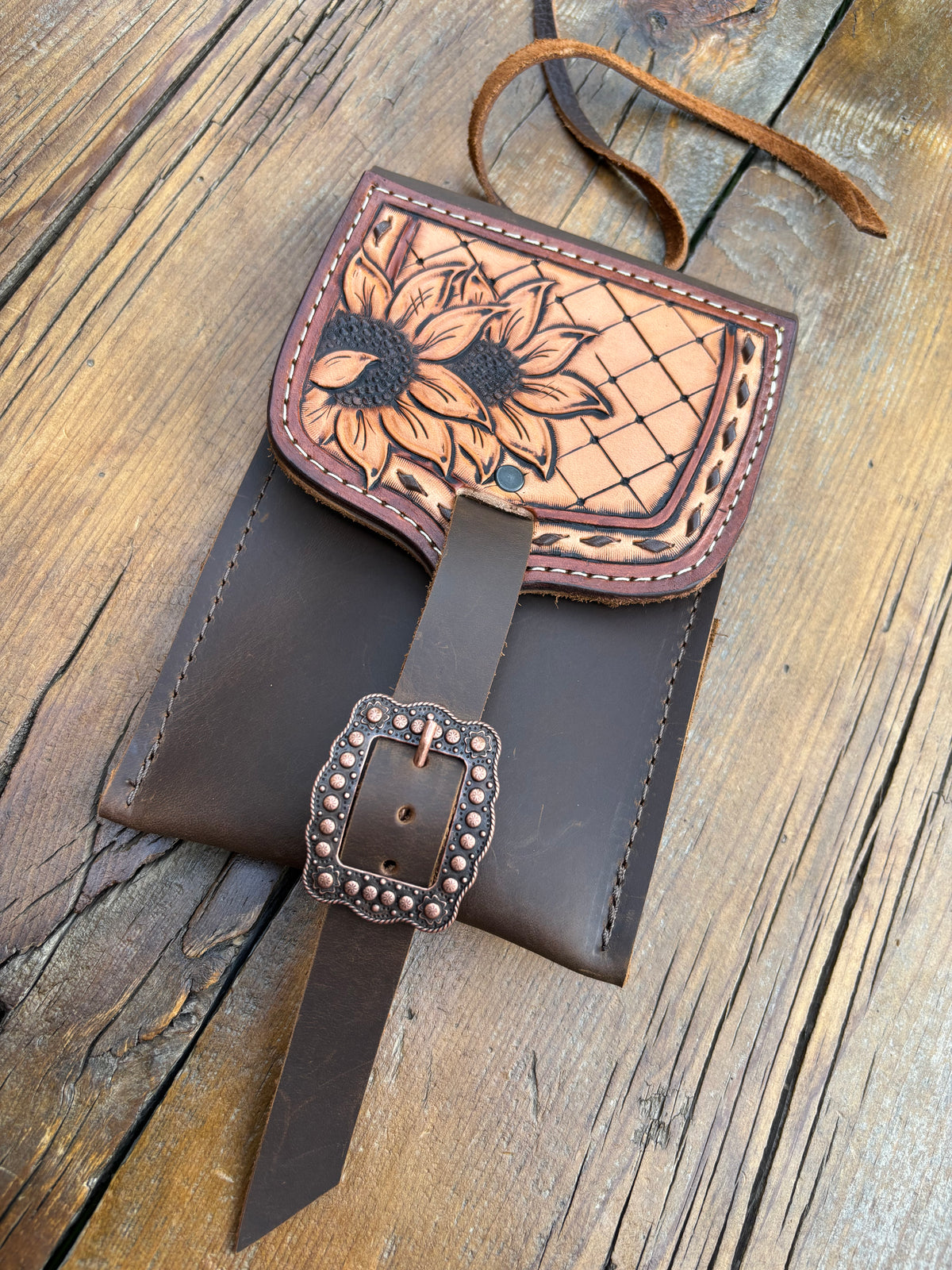 Saddle pouch cell phone holder