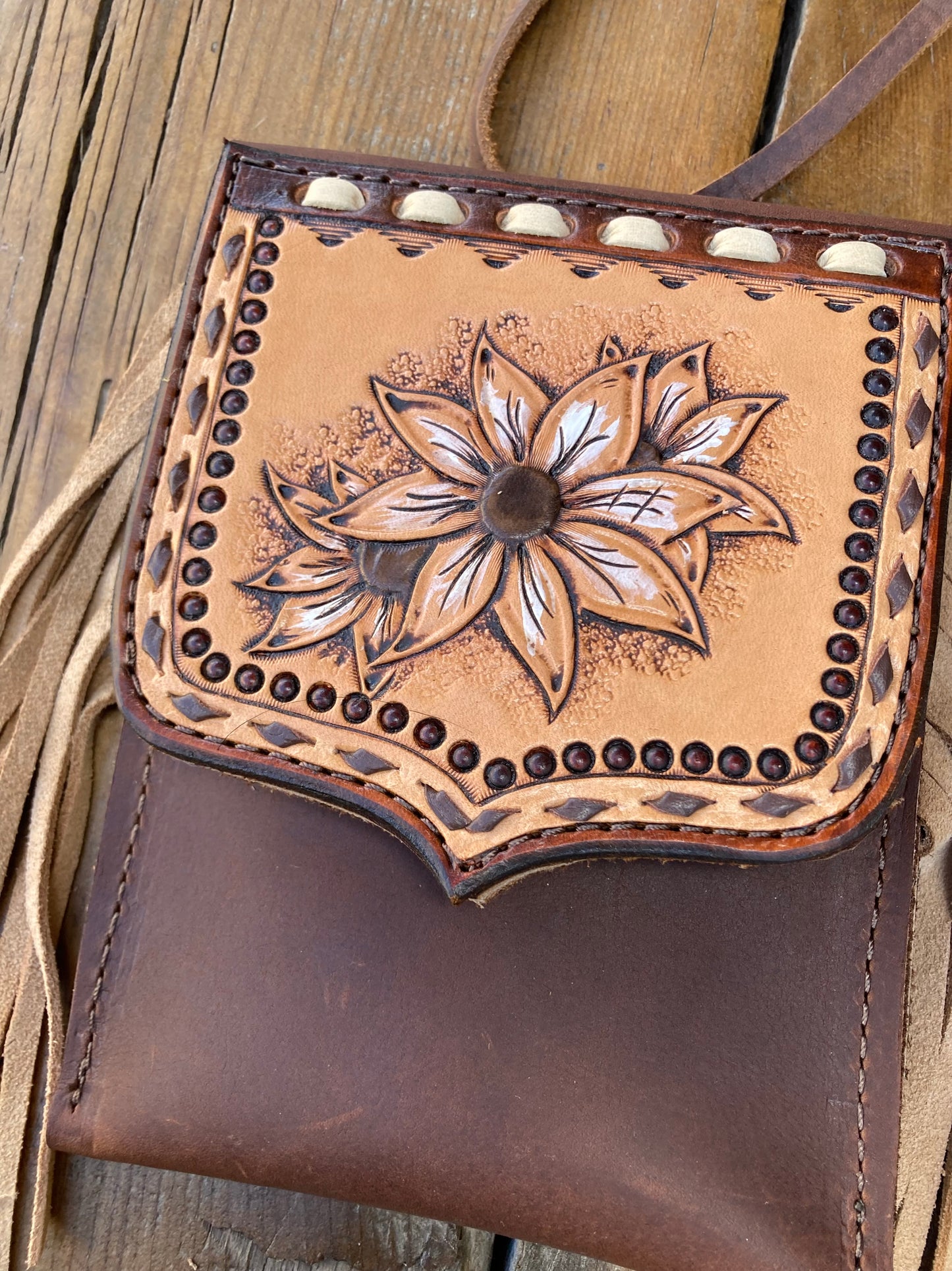 Saddle pouch cell phone holder