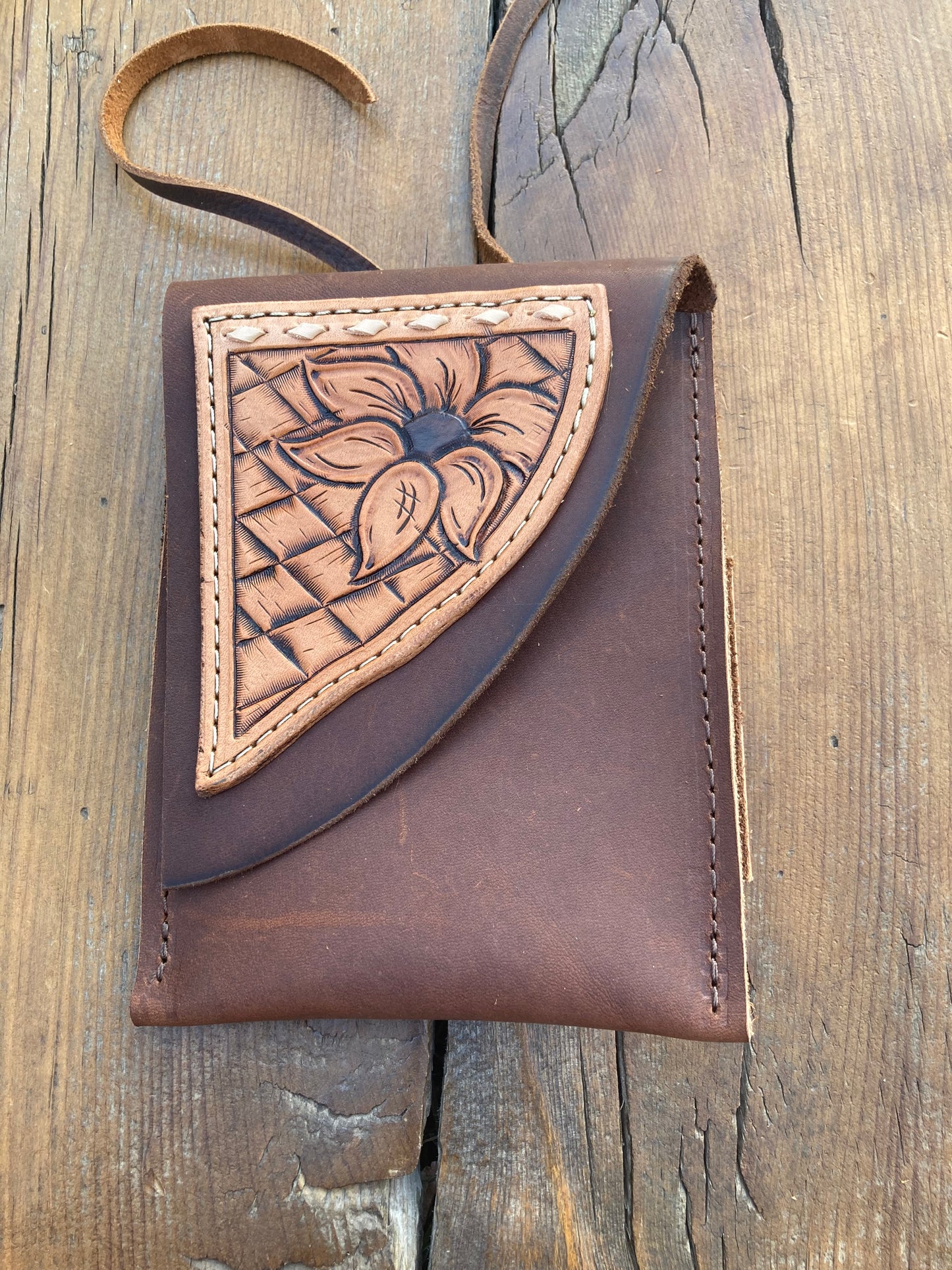 Saddle pouch cell phone holder