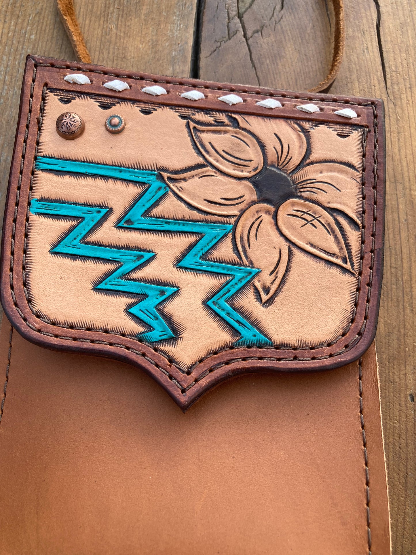 Saddle pouch cell phone holder