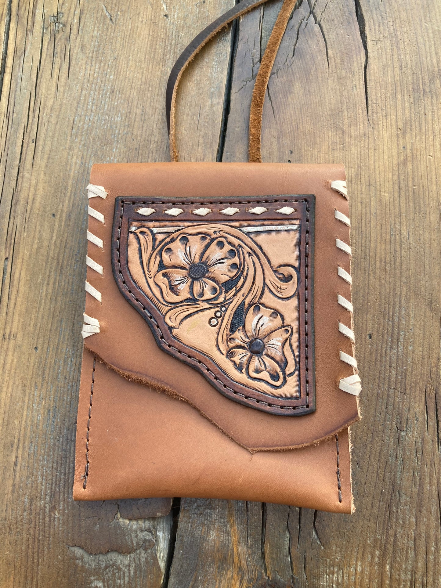 Saddle pouch cell phone holder