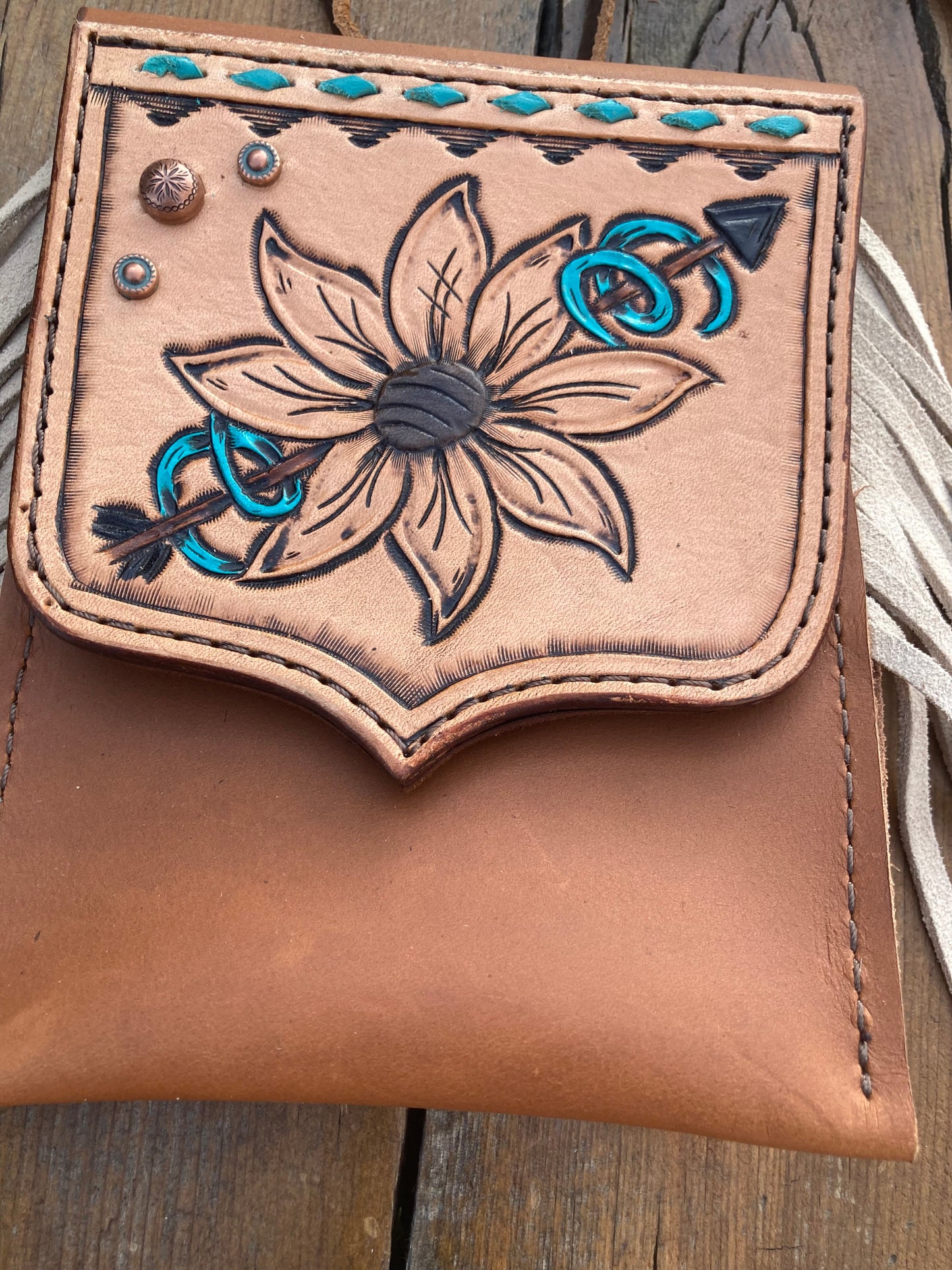 Saddle pouch cell phone holder