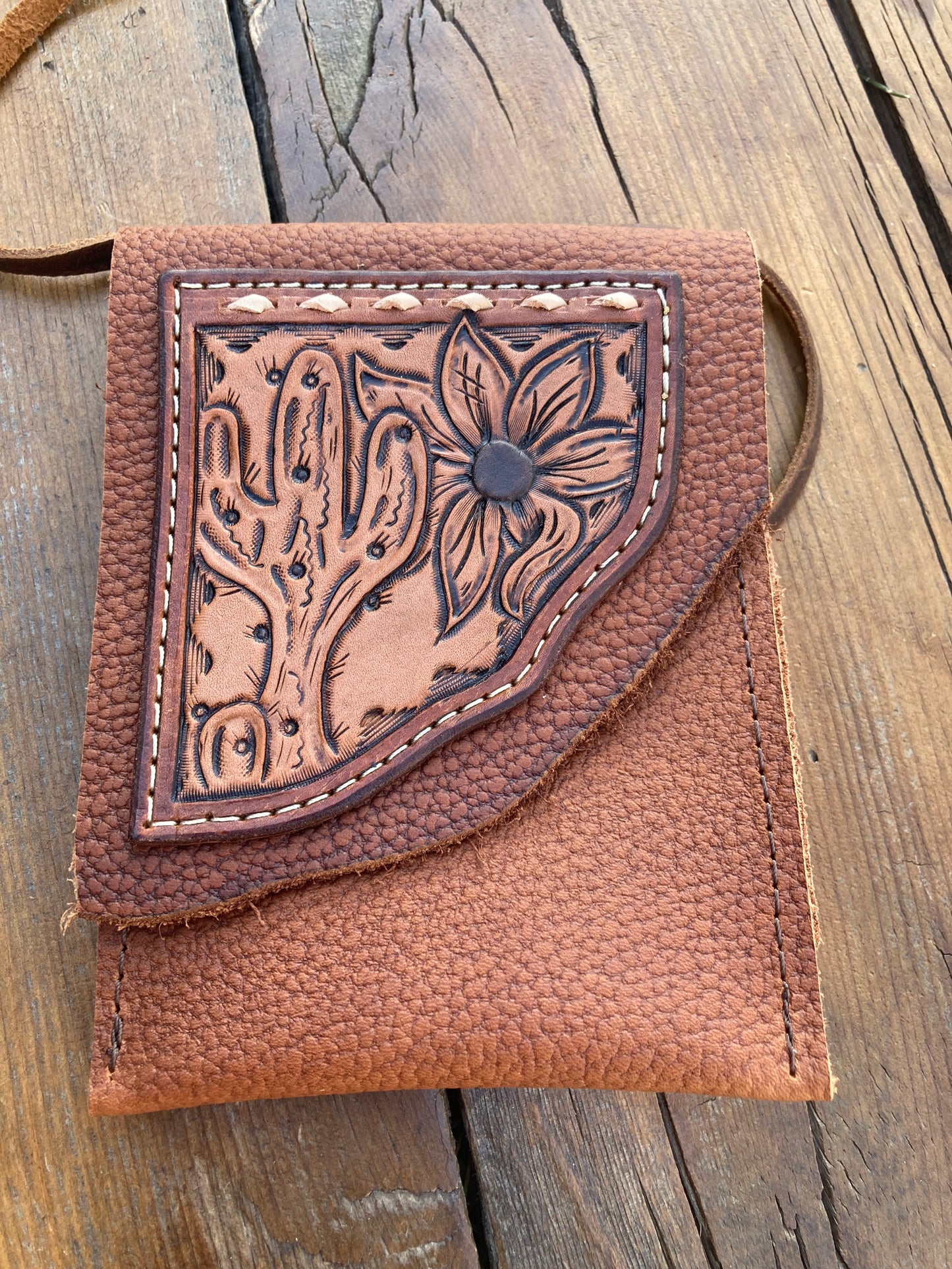 Saddle pouch cell phone holder