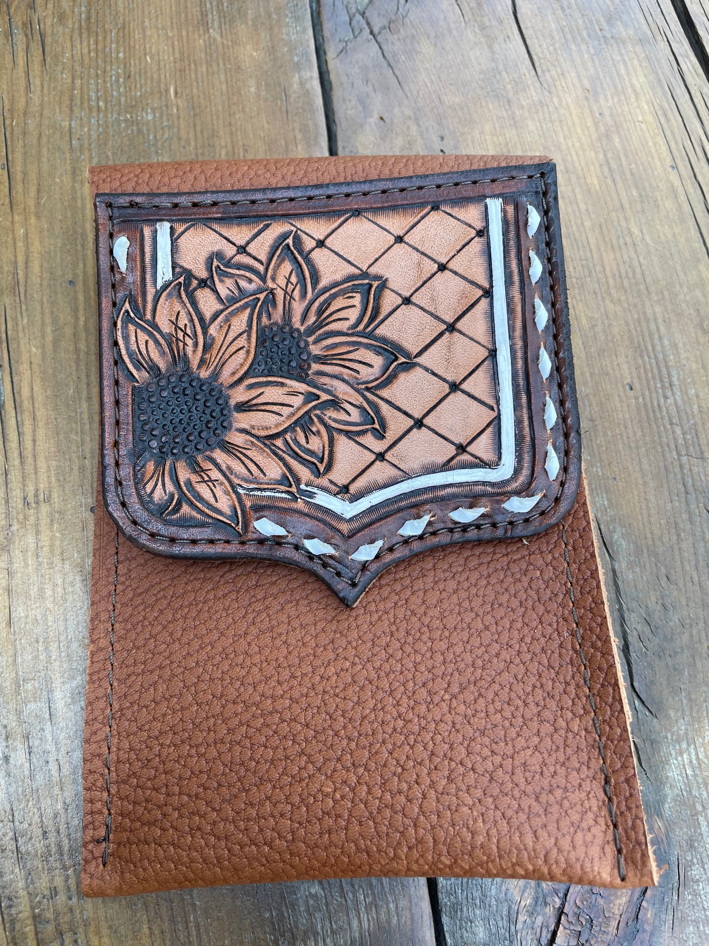Saddle pouch cell phone holder