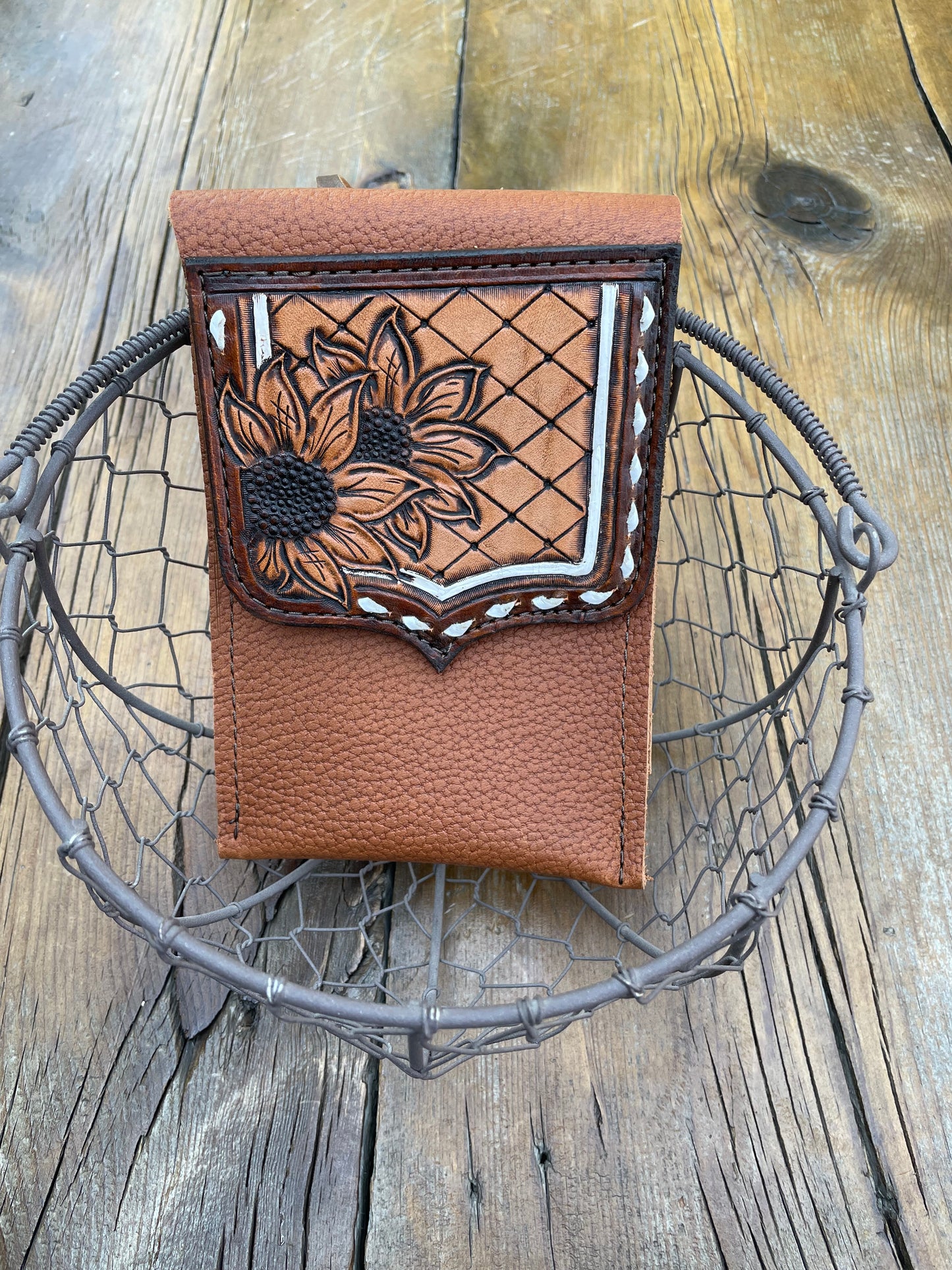 Saddle pouch cell phone holder