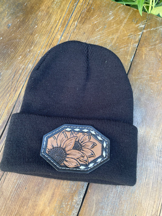 Black beanie with sunflower leather patch and buck stitch