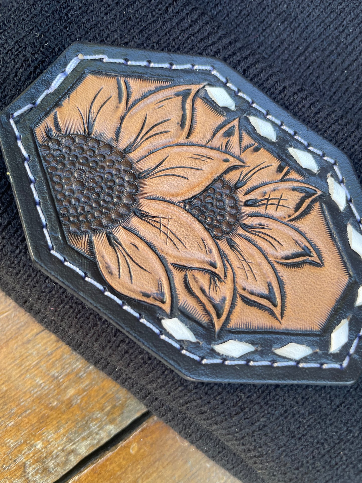 Black beanie with sunflower leather patch and buck stitch