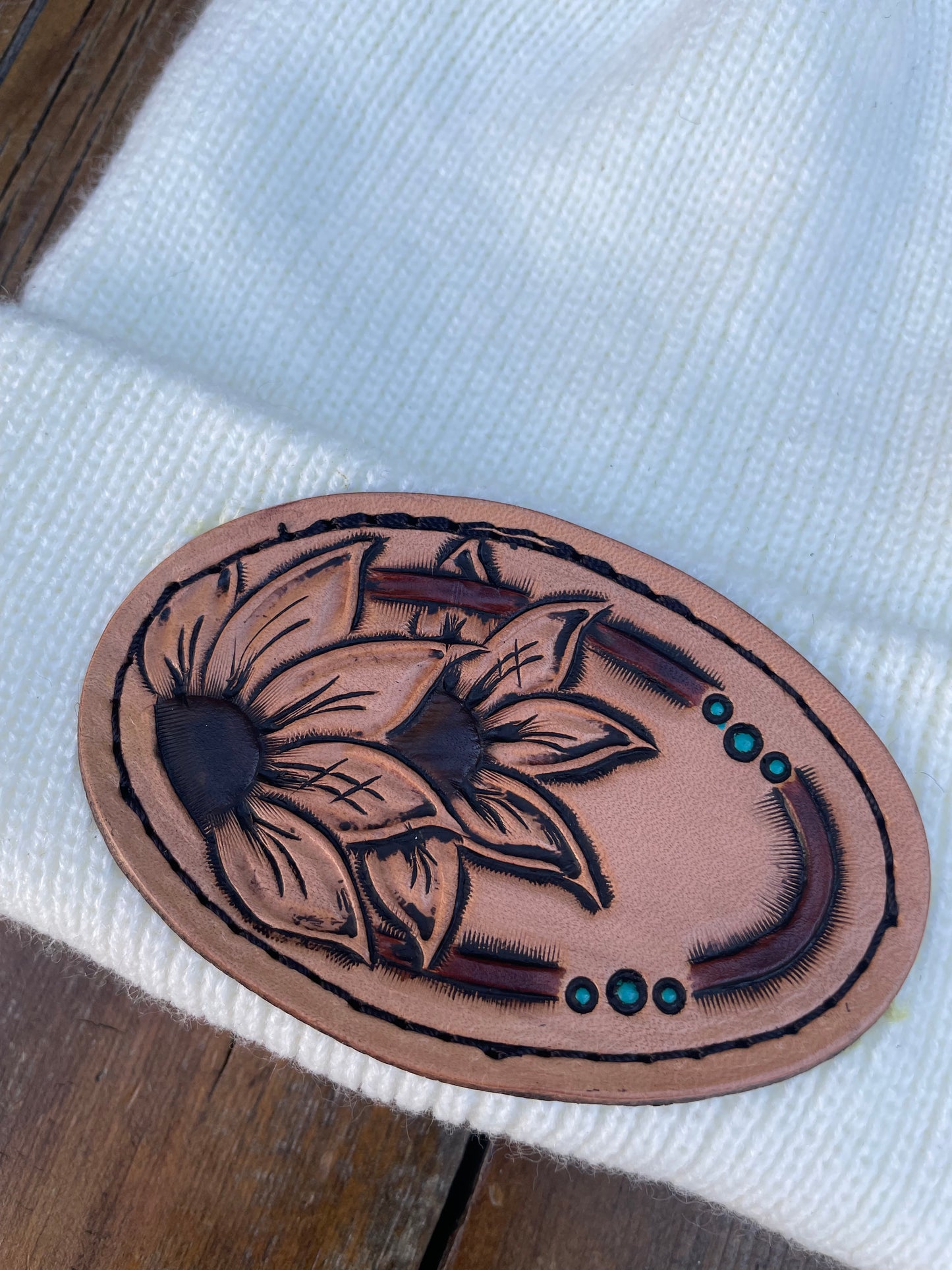 White beanie with flower leather patch