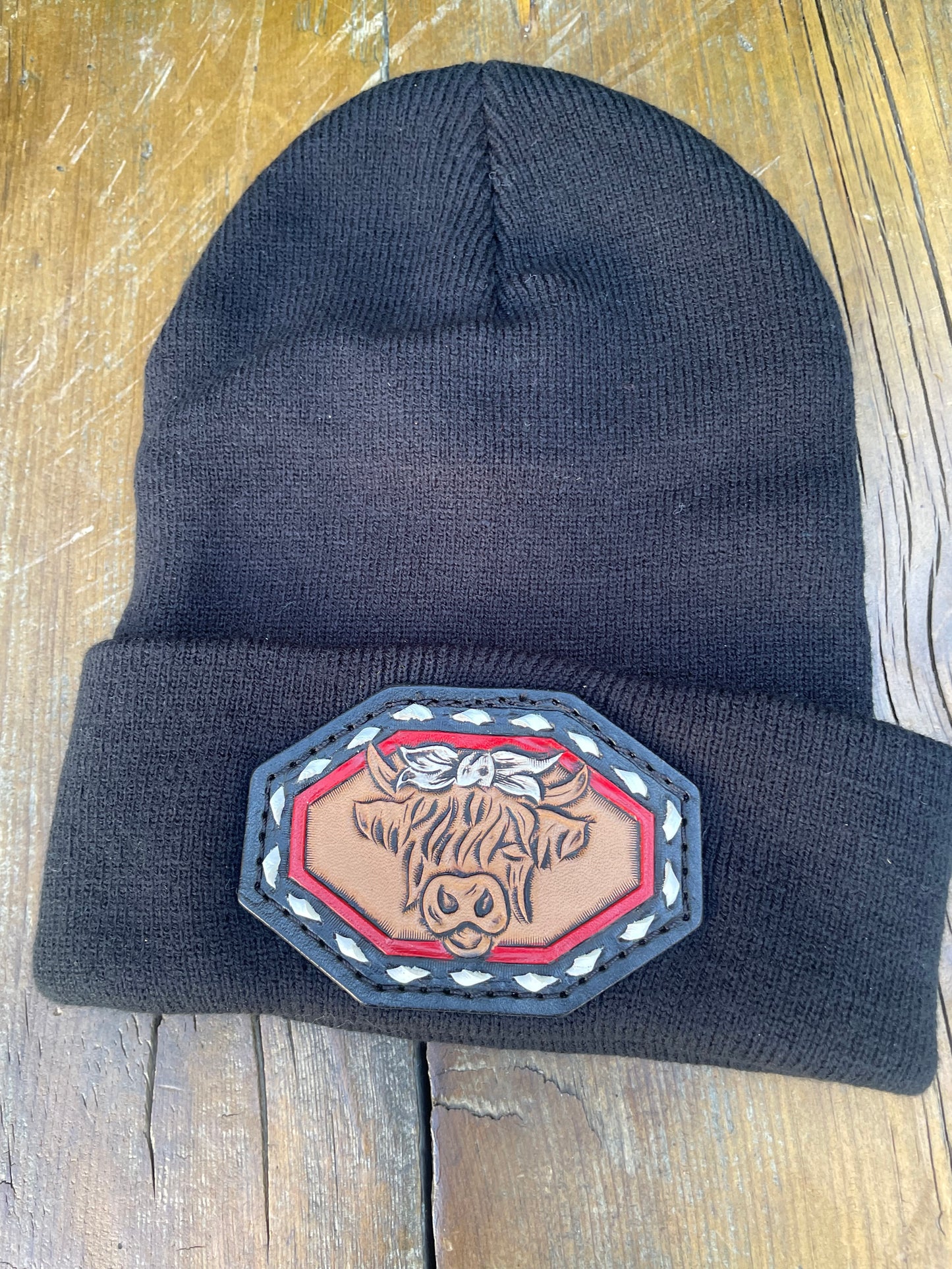 Black beanie with highlander cow and buck stitch