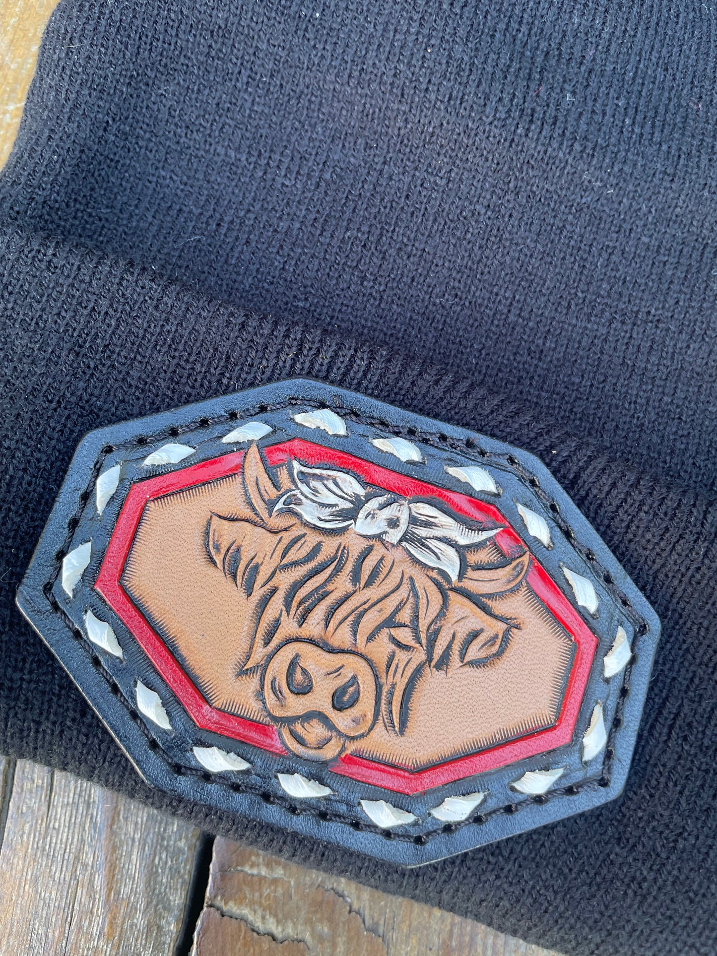 Black beanie with highlander cow and buck stitch