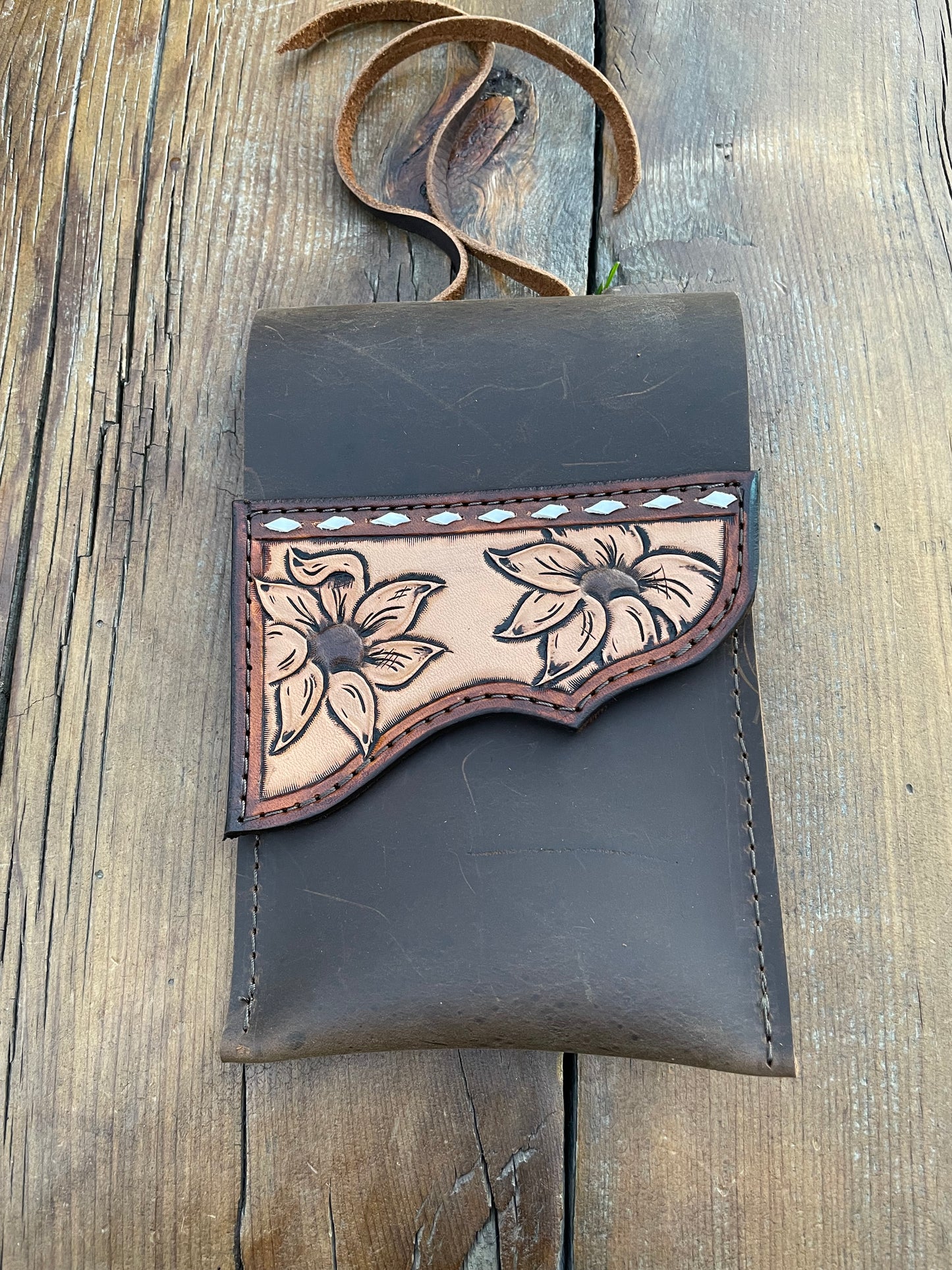 Saddle pouch cell phone holder