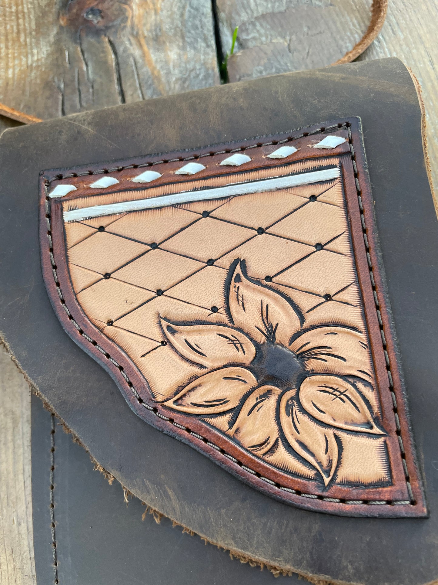 Saddle pouch cell phone holder