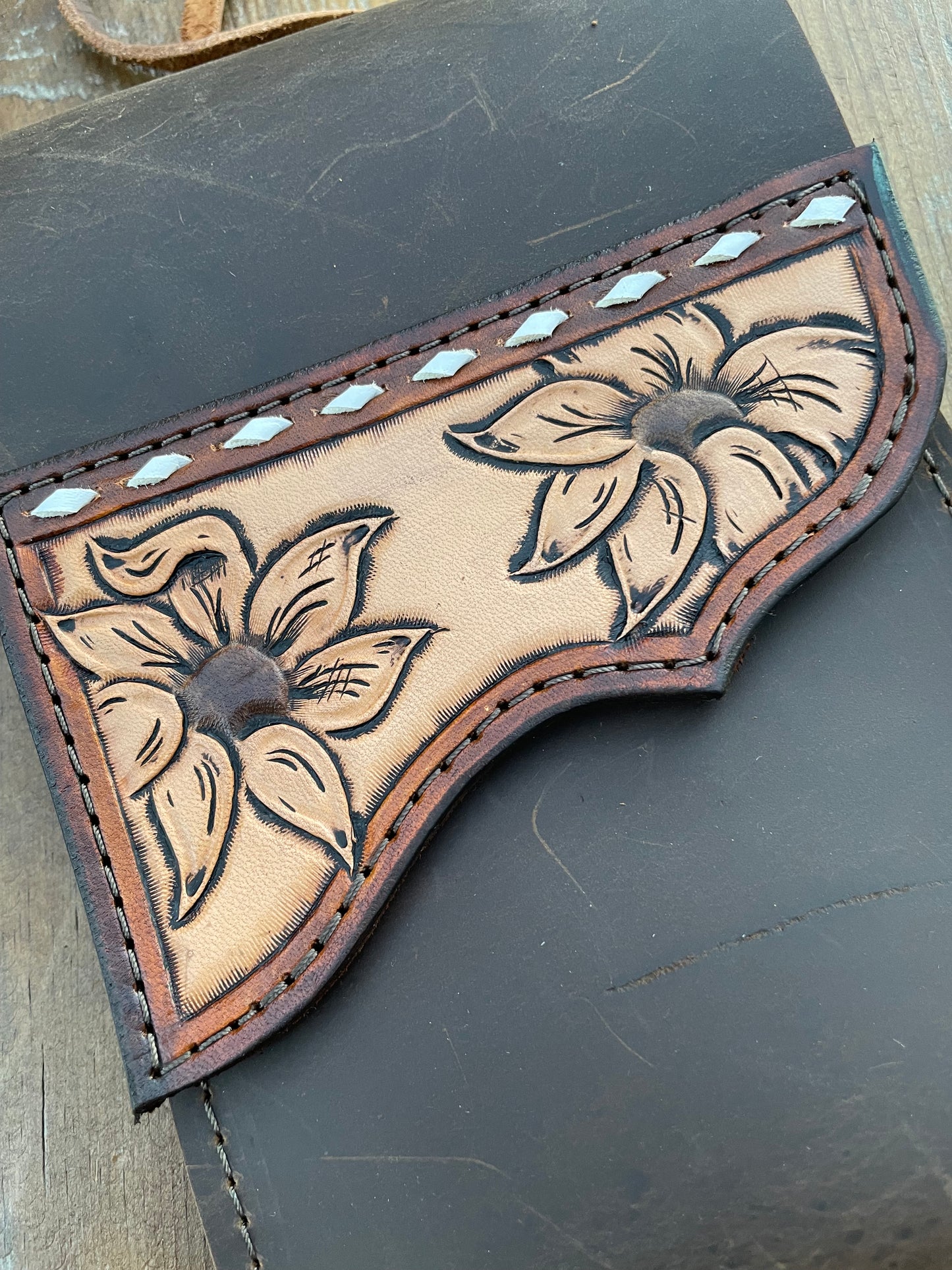 Saddle pouch cell phone holder