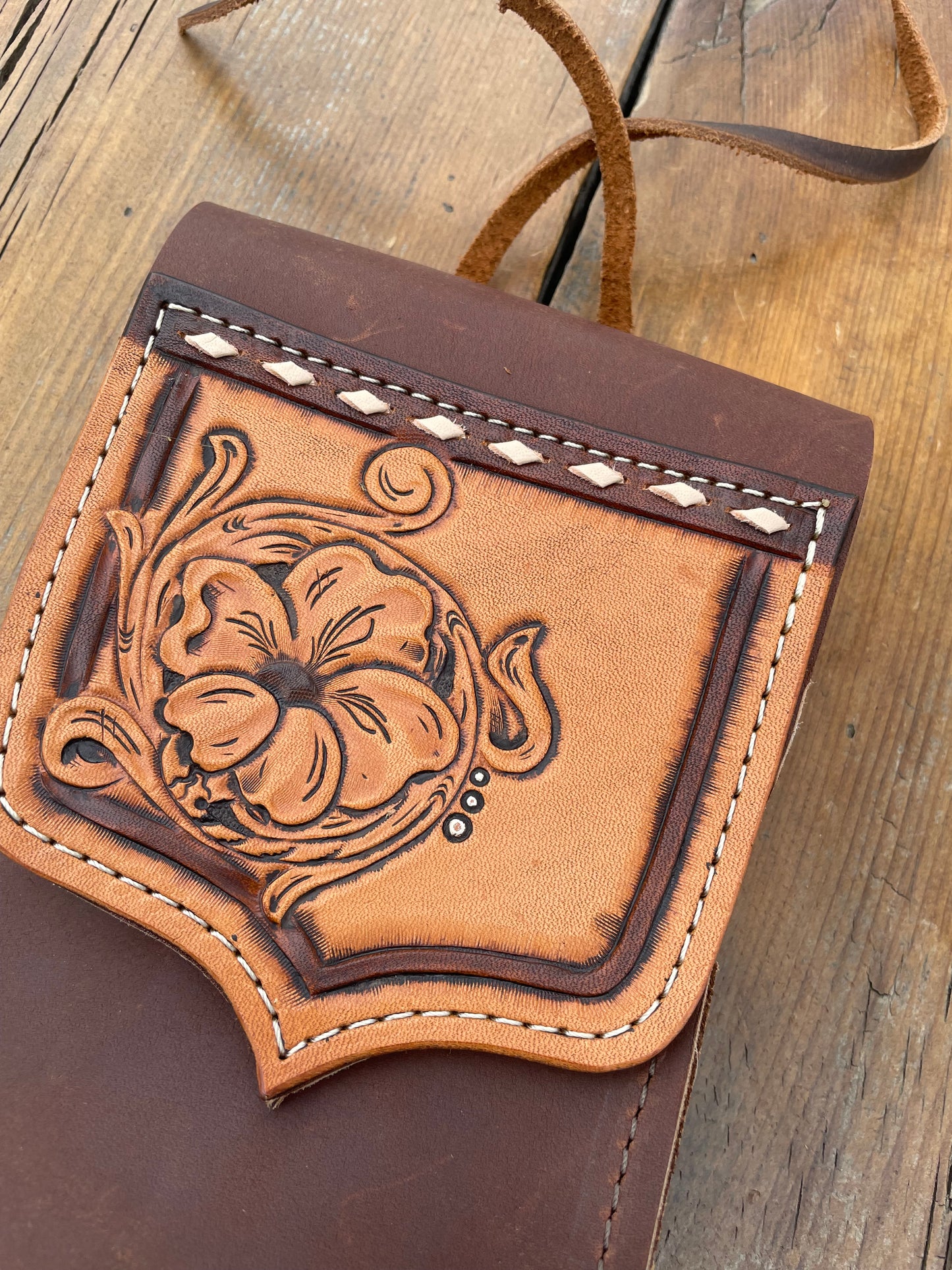 Saddle pouch cell phone holder
