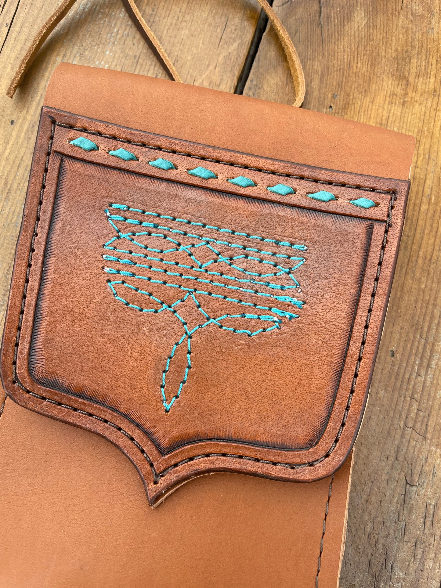 Saddle pouch cell phone holder